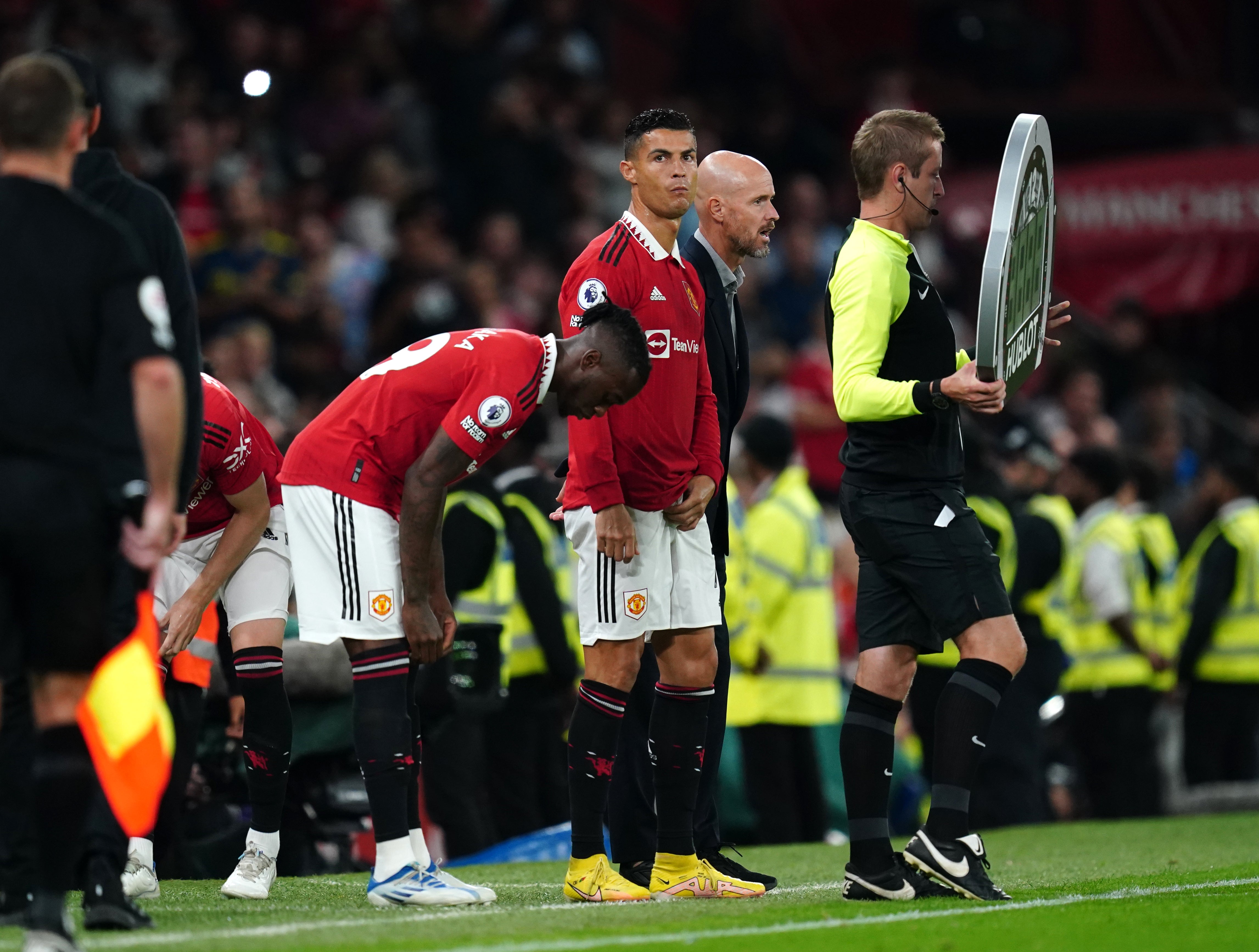 Erik Ten Hag (centre right) introduced Cristiano Ronaldo (centre) in a triple substitution against Liverpool (David Davies/PA)