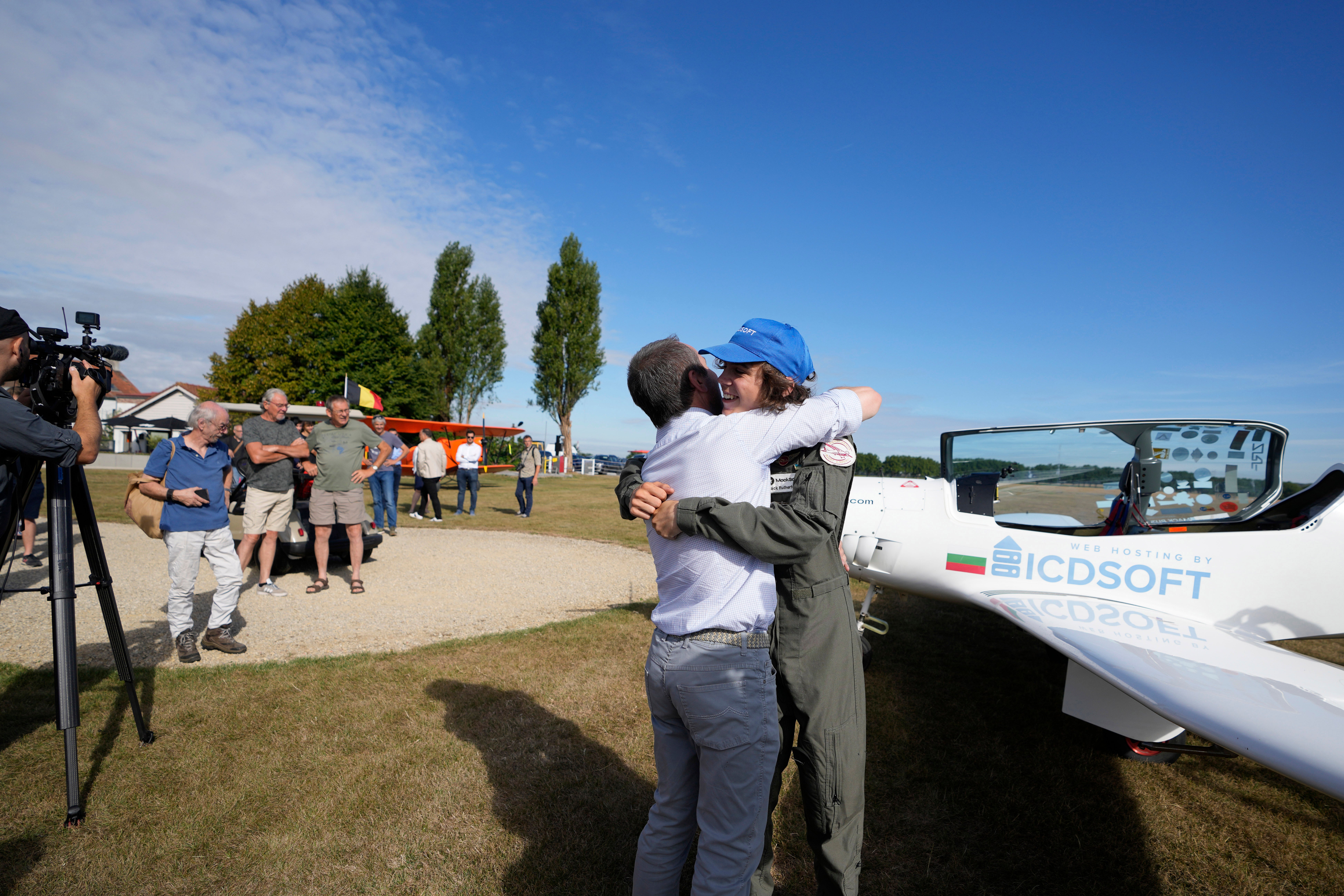 Mack Rutherford greeted by his father after landing in Belgium before flying on to Slovakia and Bulgaria or the final leg of his journey