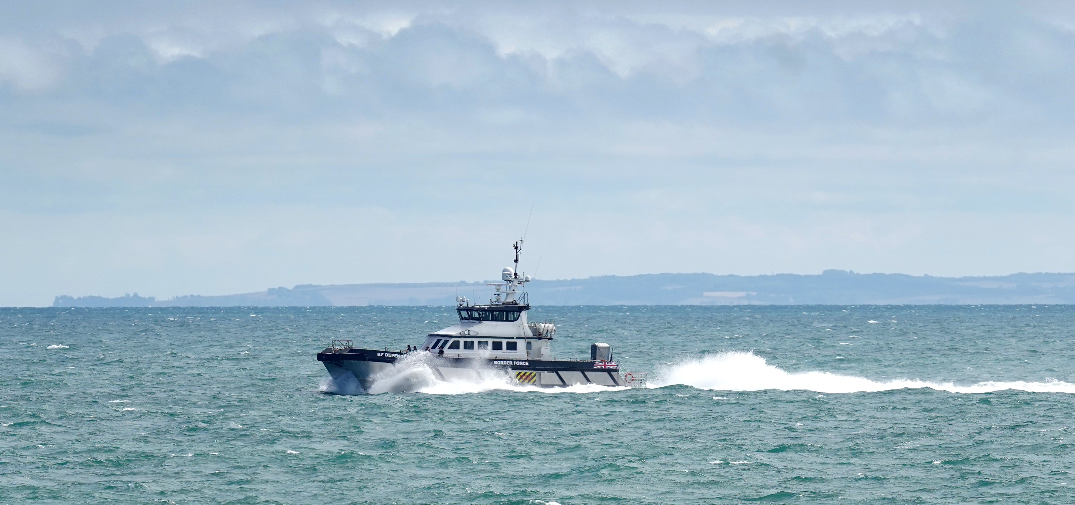 Border Force vessel Defender carries a group of people thought to be migrants in to Dover, Kent, following a small boat incident in the Channel. Picture date: Tuesday August 23, 2022. (Gareth Fuller/PA)