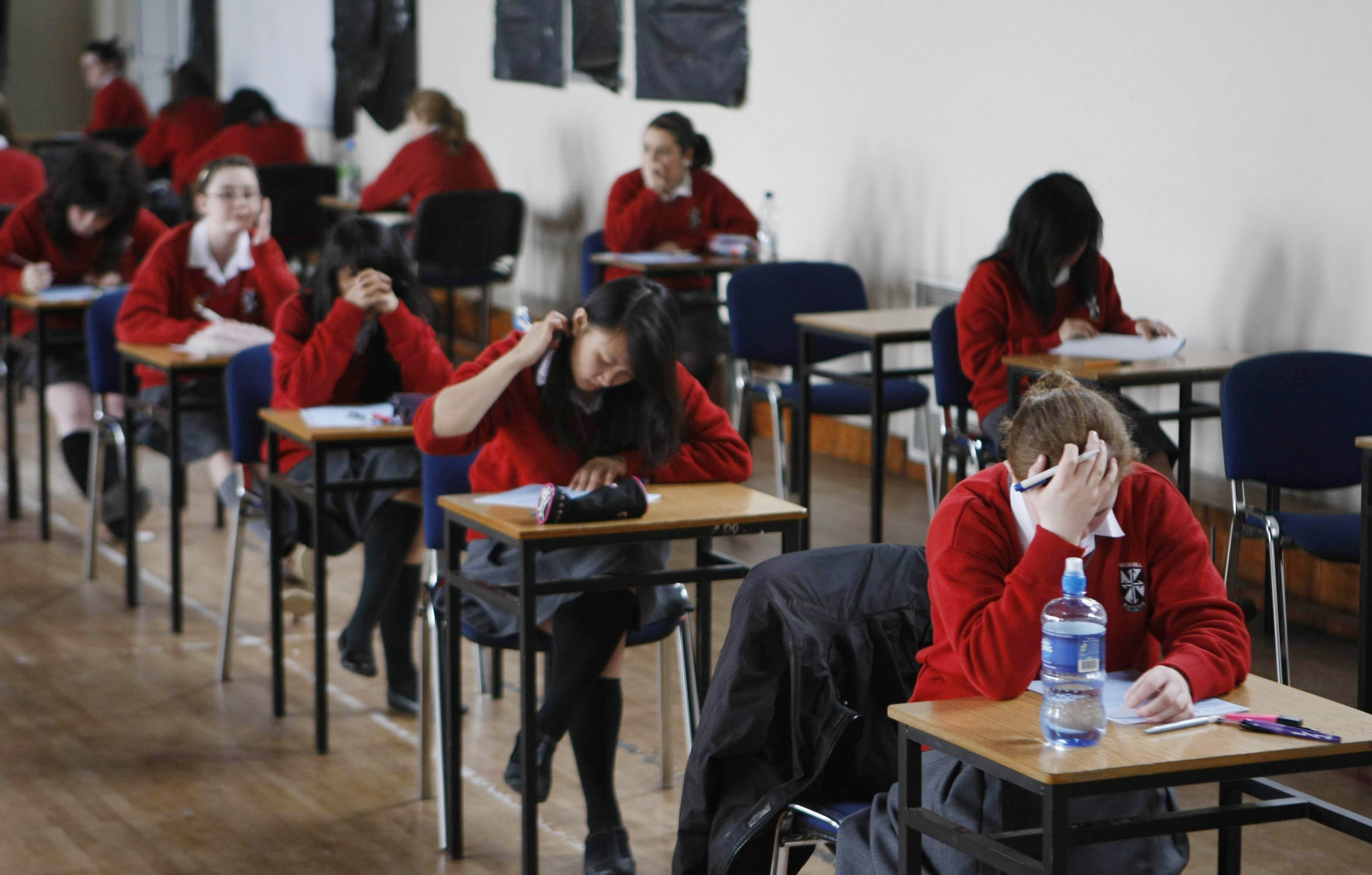 File photo of students sitting an exam (Niall Carson/PA)