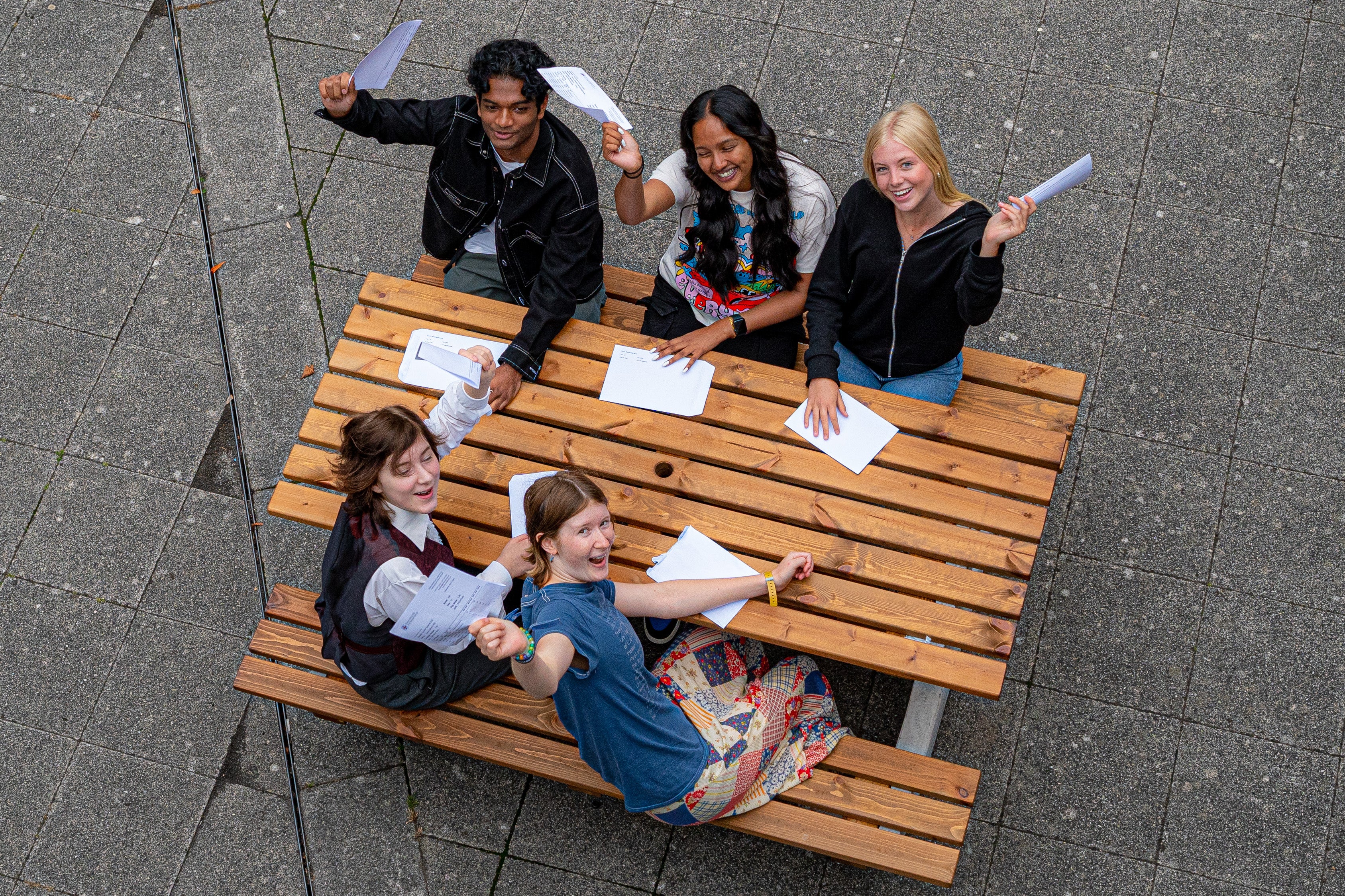 Students at St Mary Redcliffe and Temple School in Bristol celebrate their GCSE results (Ben Birchall/PA)