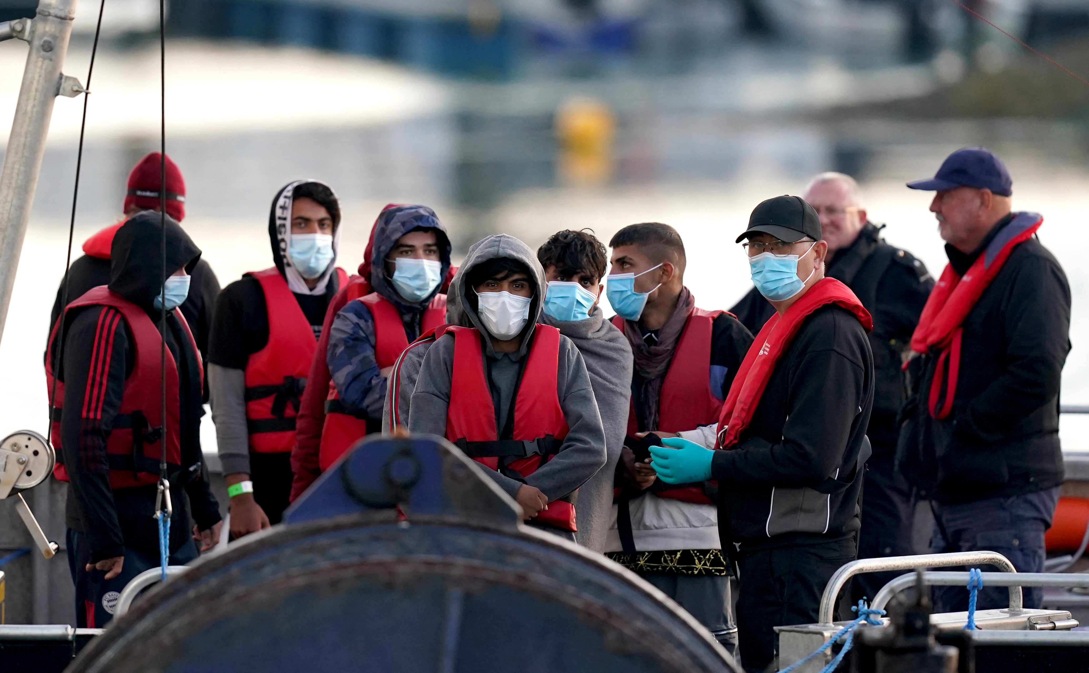 A group of people thought to be migrants are brought in to Dover