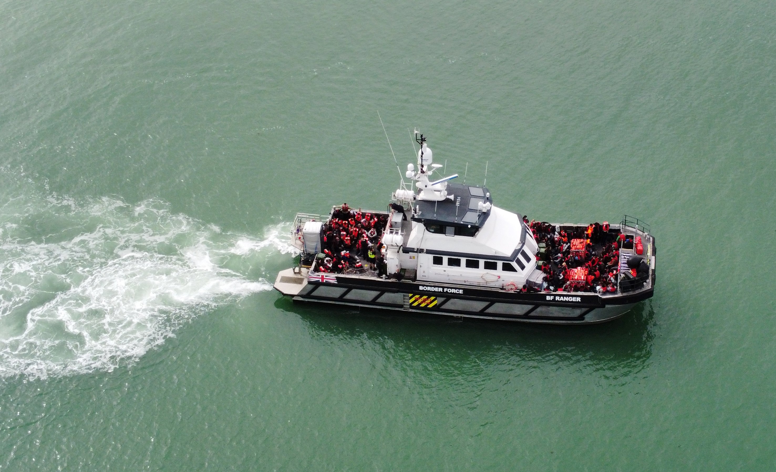 A group of people thought to be migrants are brought in to Ramsgate, Kent, onboard a Border Force vessel following a small boat incident in the Channel (Gareth Fuller/PA)