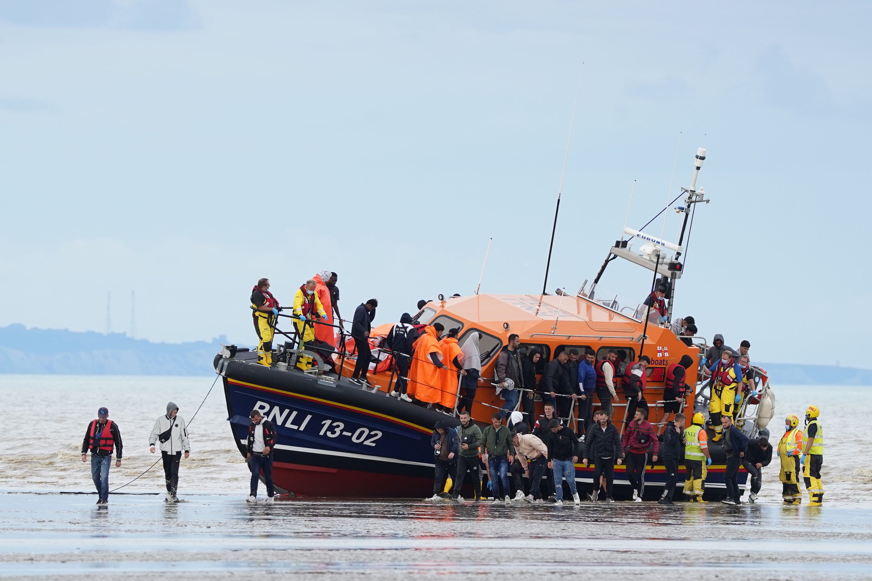 Migrants were brought ashore at Dungeness, in Kent, after crossing the Channel on Thursday