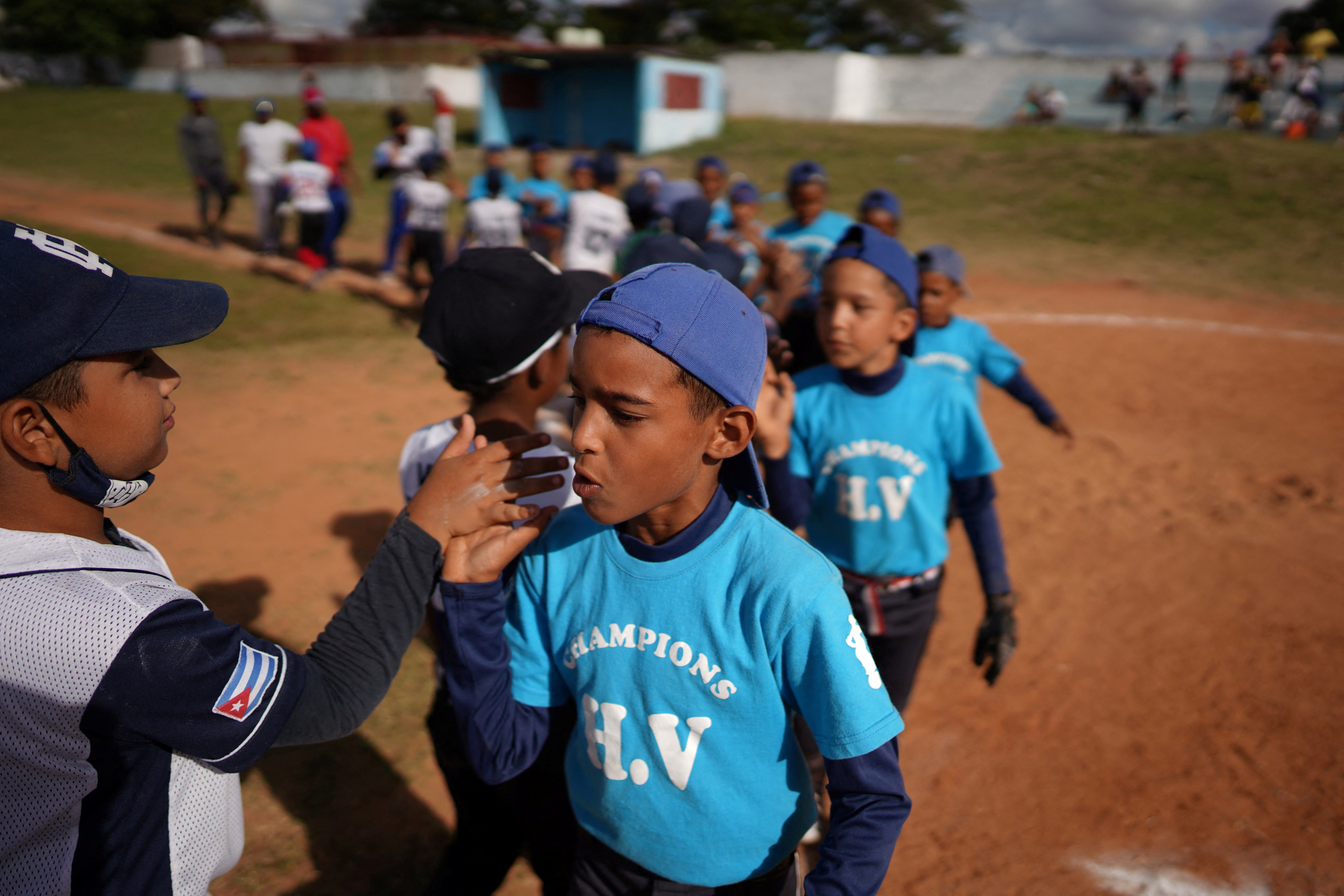 Children high five after the match