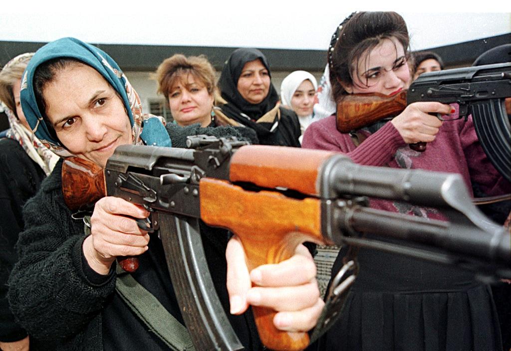 Iraqi woman train to use AK-47s in 1999