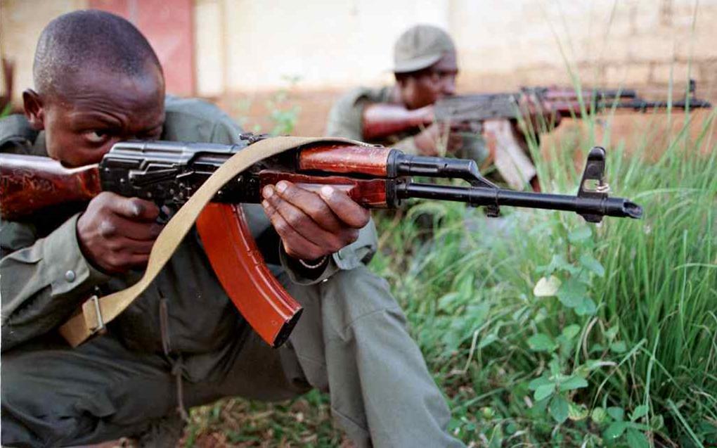 Two Congolese army soldiers take position with their AK-47s