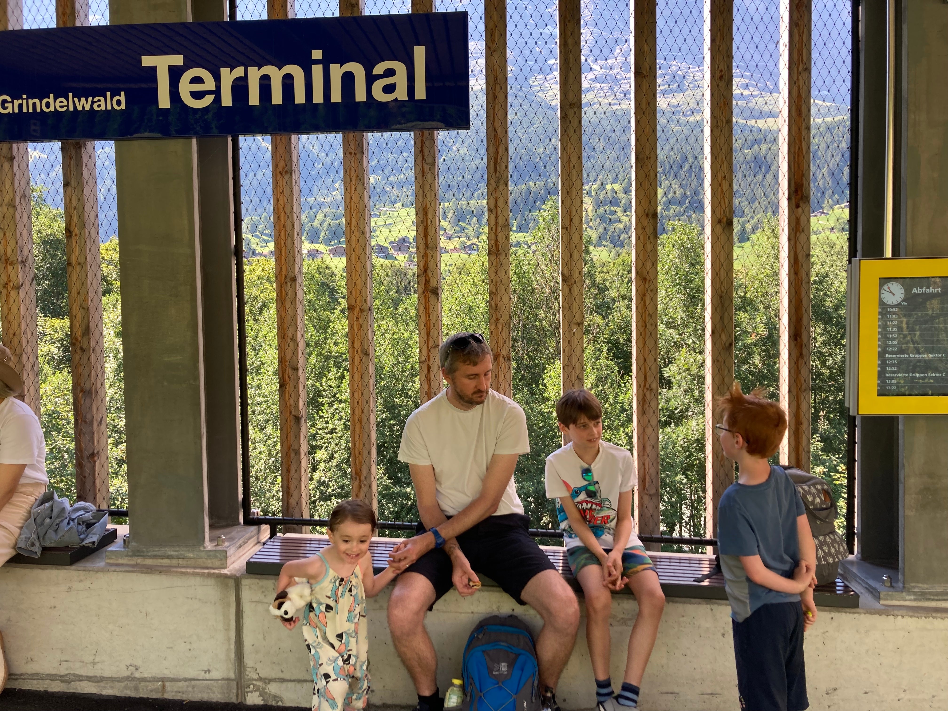 Tom and the kids waiting at one of the many stations