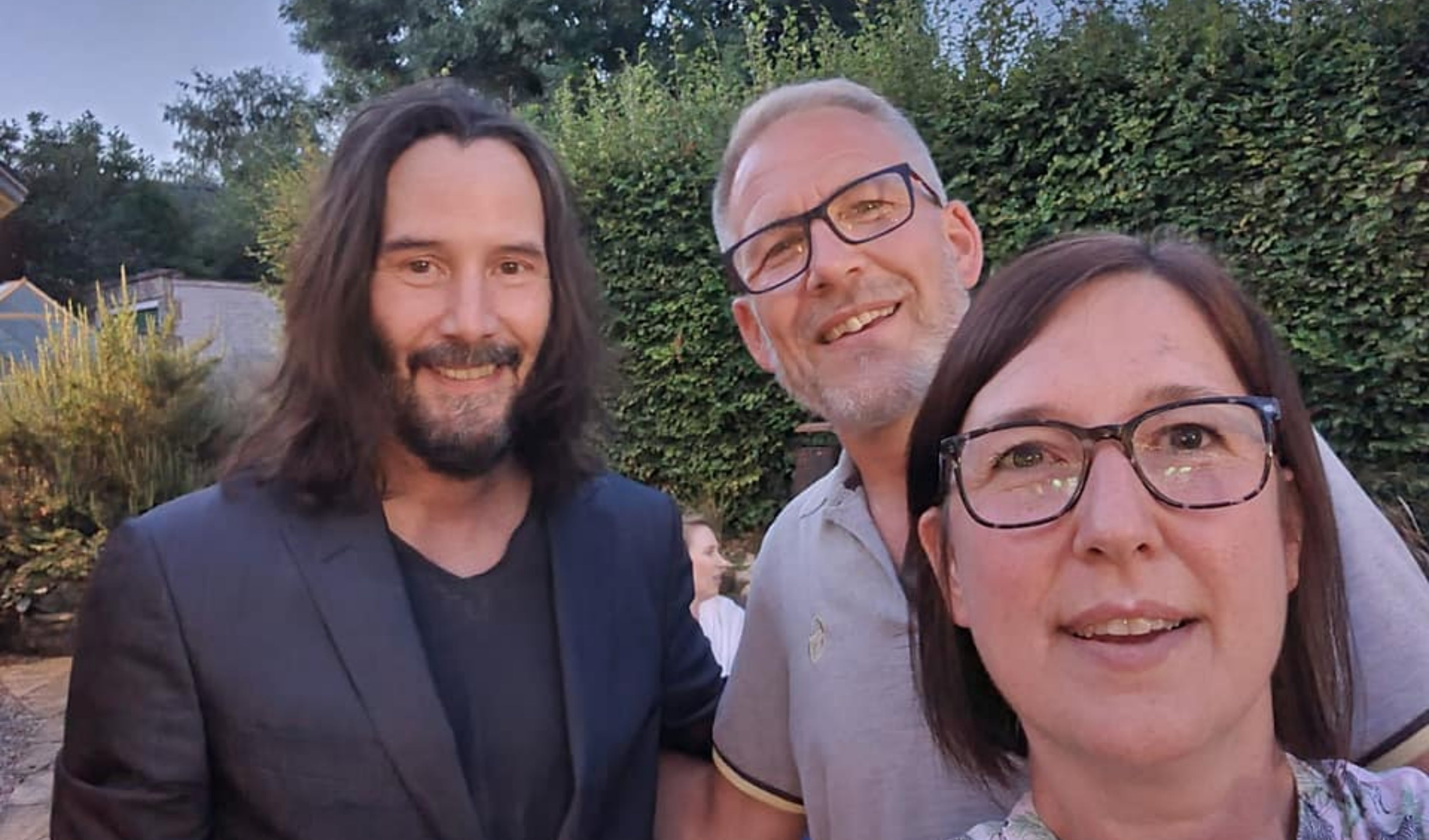 Keanu Reeves poses for a selfie with Dianne King and her husband Jason (Dianne King/PA)