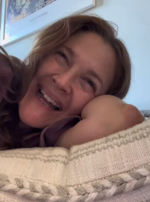 Drew Barrymore listening to Britney Spears and Elton John’s song, ‘Hold Me Closer'