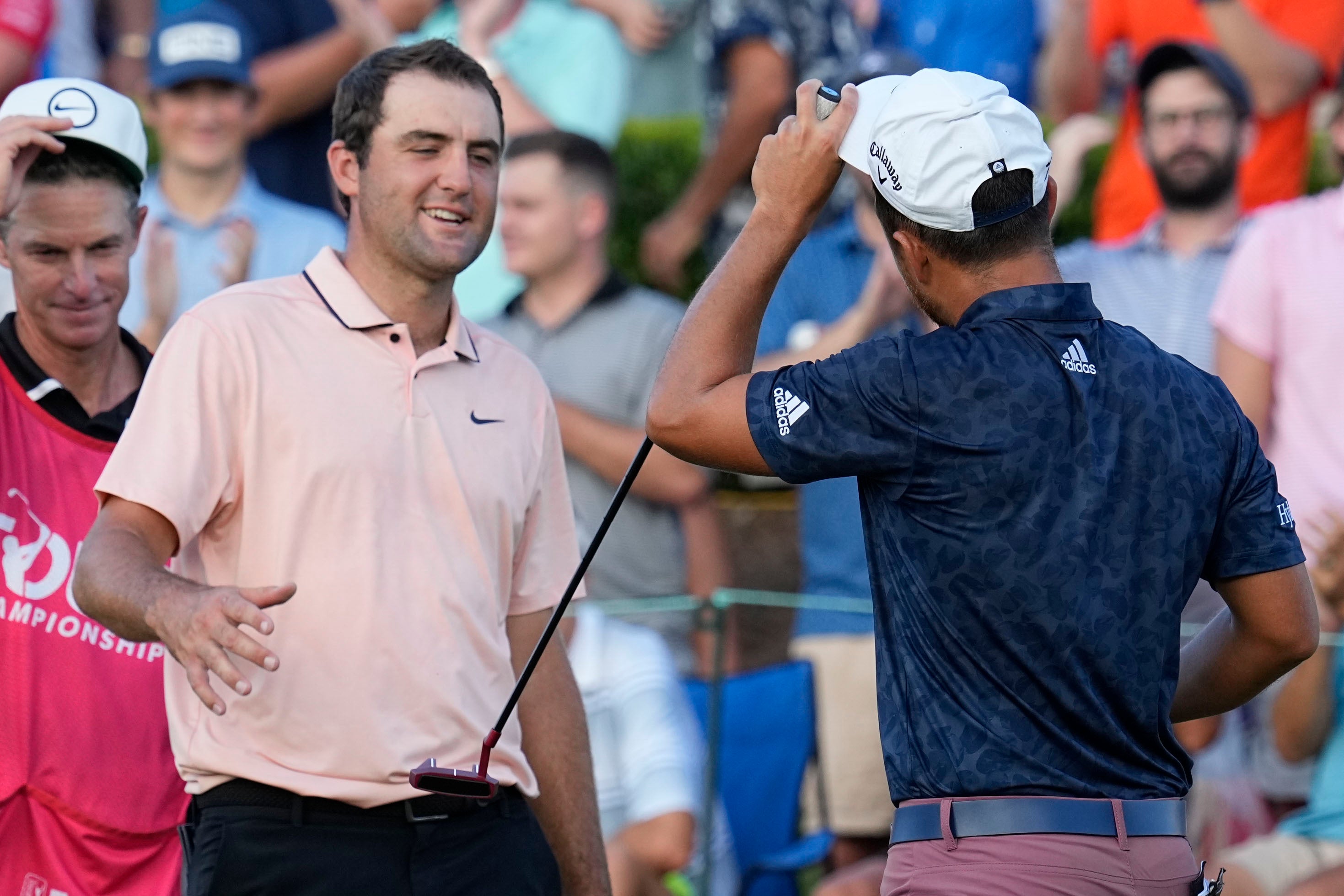 Scottie Scheffler (left), speaks with Xander Schauffele after their second round of the Tour Championship (Steve Helber/AP)