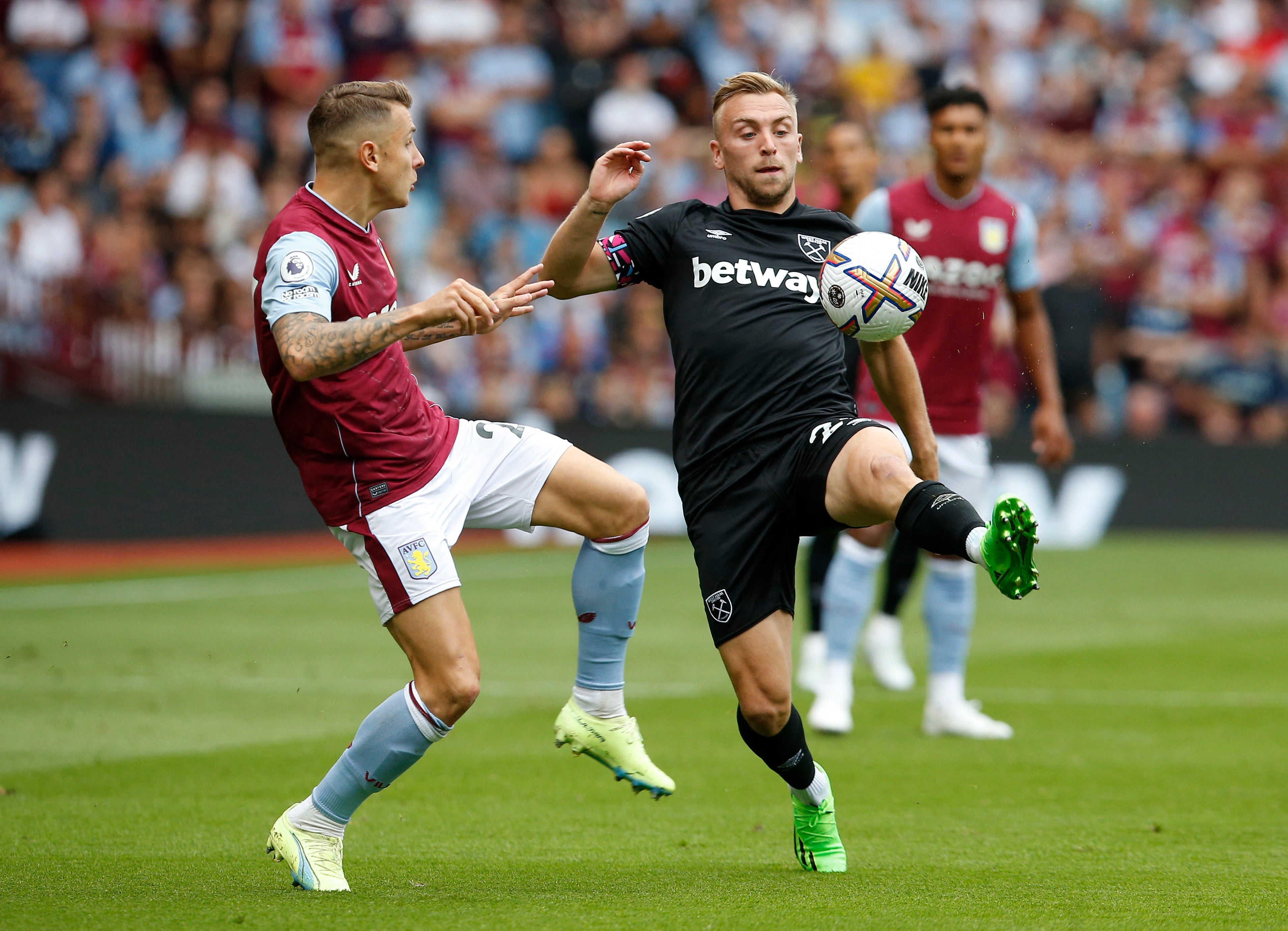 Jarrod Bowen (right) and Lucas Digne compete for the ball