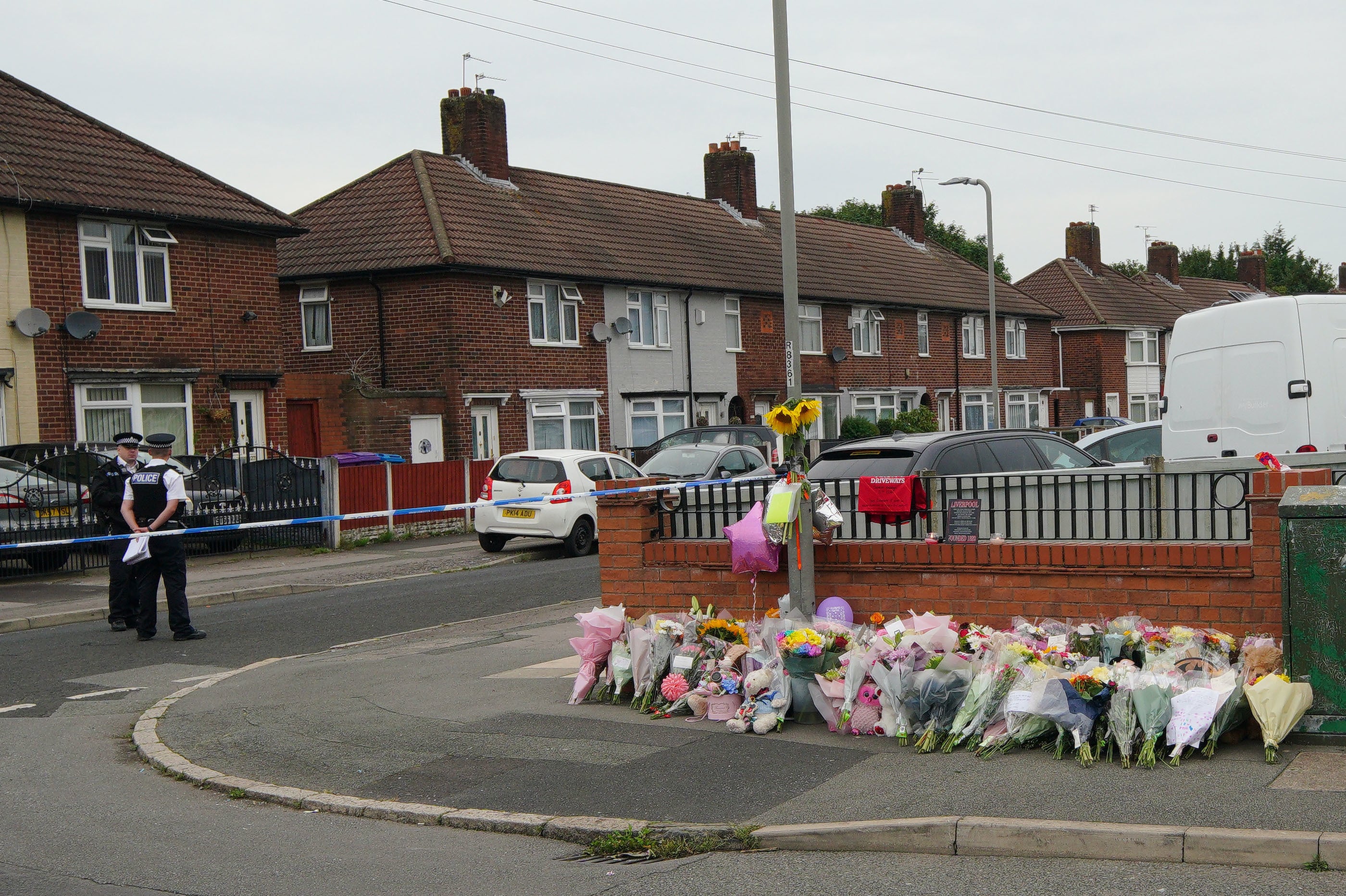 Flowers are left near the scene of an incident in Kingsheath Avenue, Knotty Ash, Liverpool, where nine-year-old Olivia Pratt-Korbel was fatally shot last Monday night