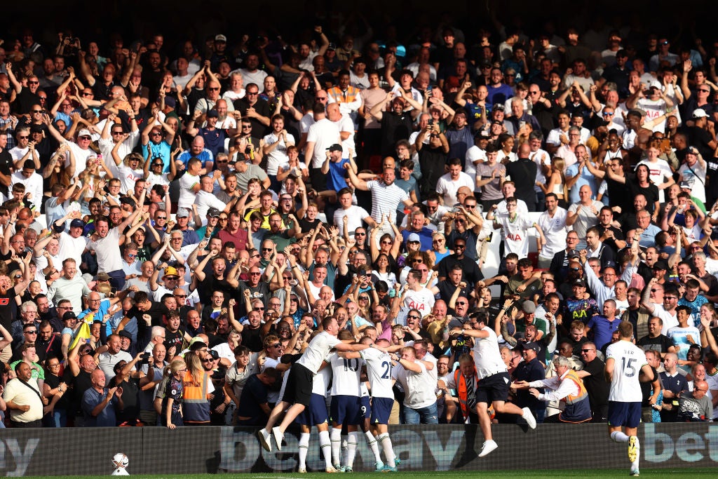 Tottenham players celebrate with the fans after Kane’s second goal