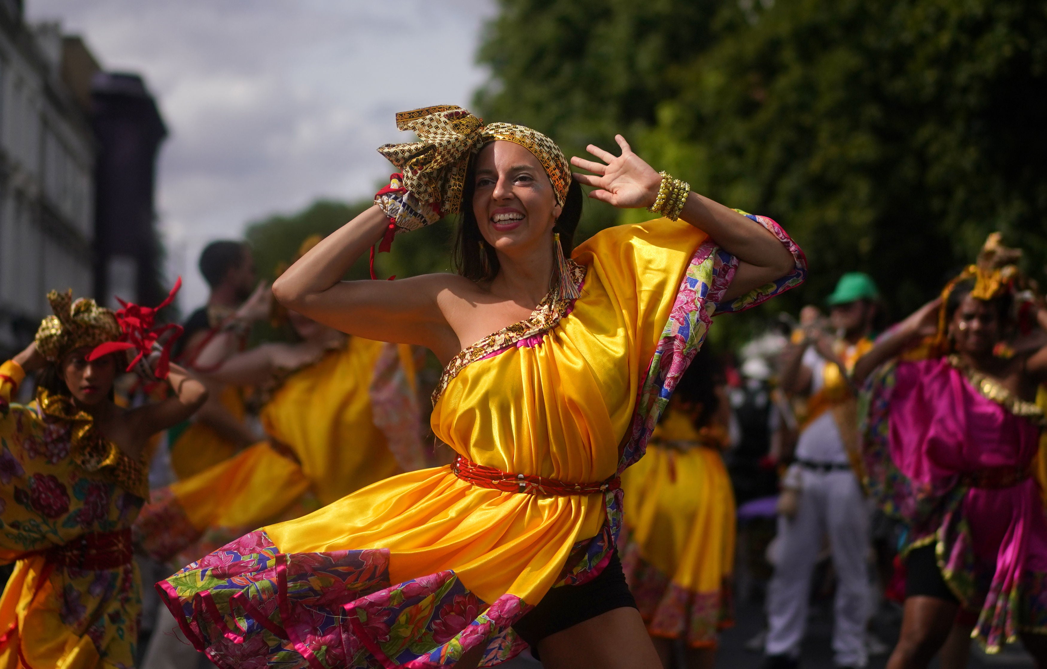 People perform during the children’s parade on Family Day