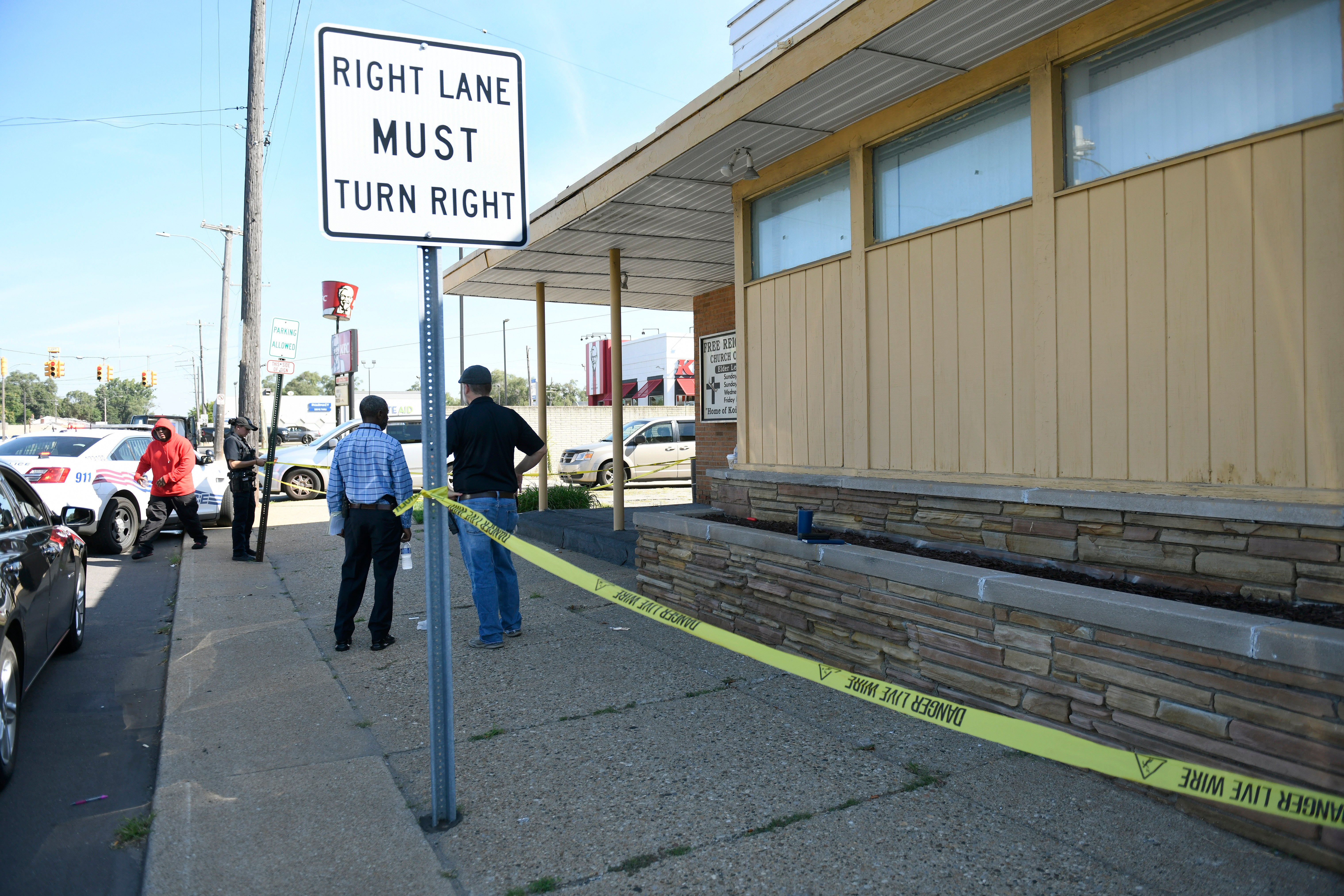 Detroit Police and investigators look over a homicide scene on Wyoming Avenue, near the corner of Seven Mile Road, Sunday, Aug. 28, 2022, in Detroit