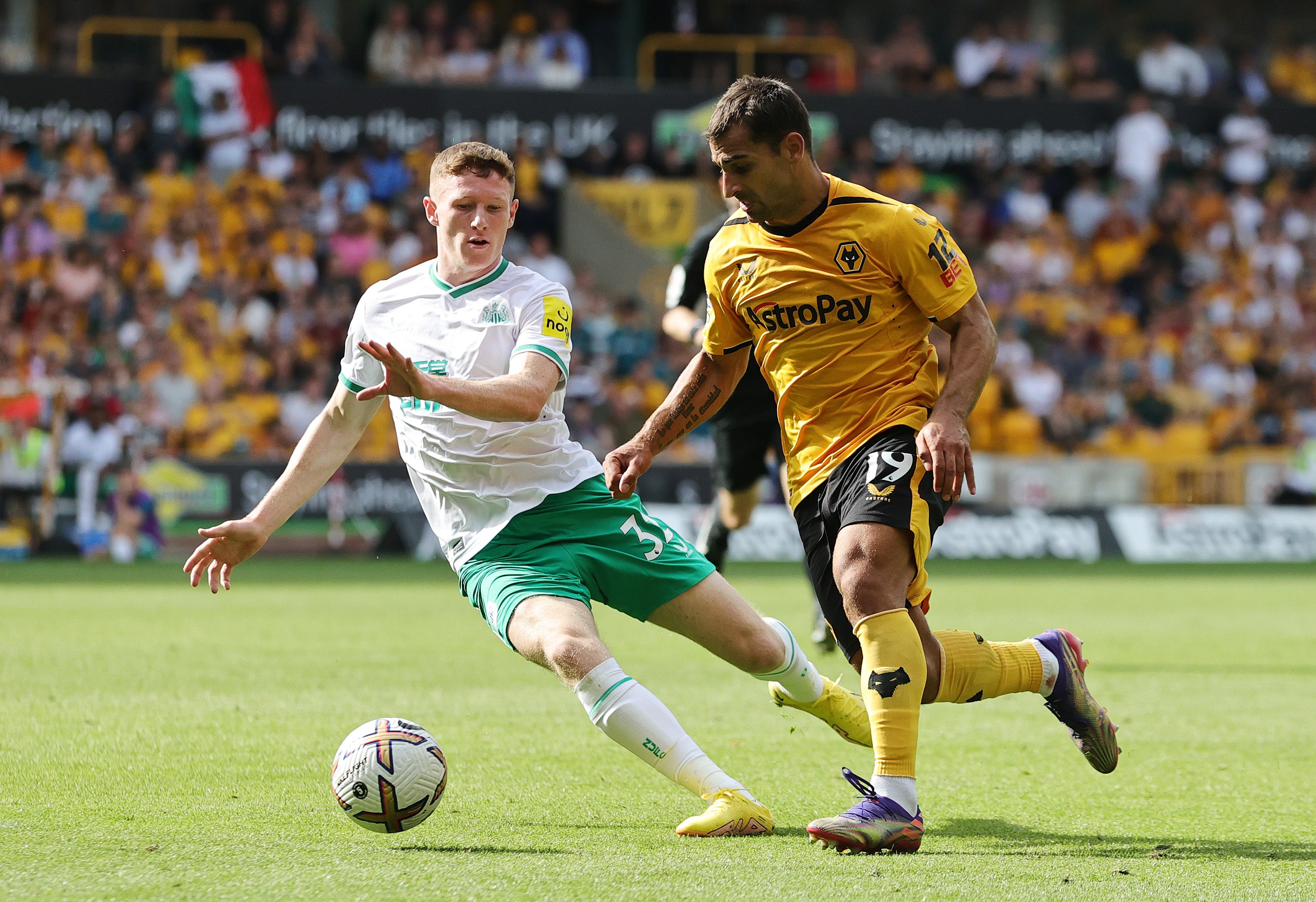 Elliot Anderson of Newcastle United battles with Jonny of Wolves
