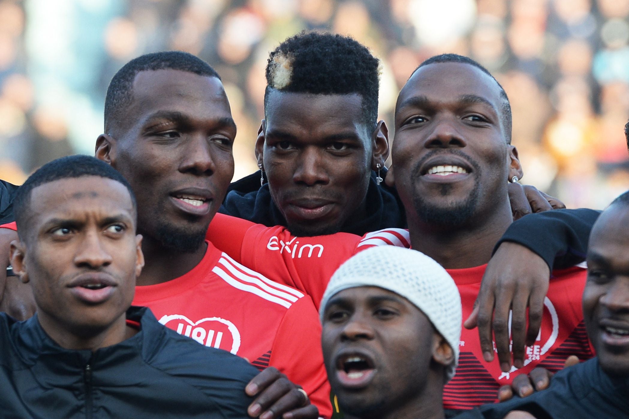 The Pogba brothers, Paul (centre), Florentin (left) and Mathias (right), at a charity football match in 2019