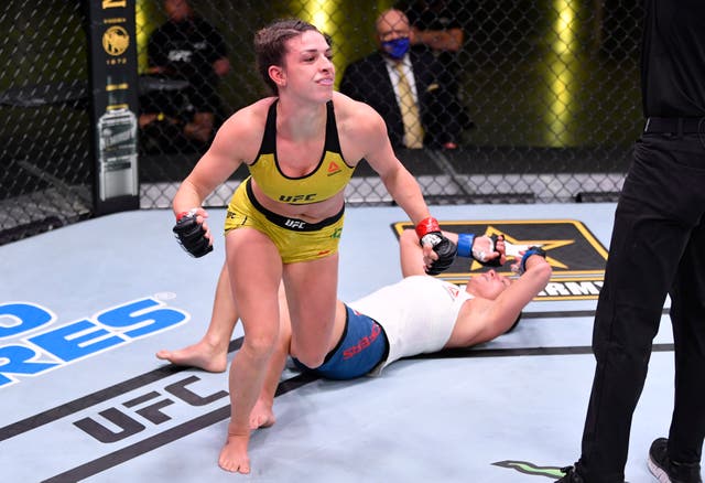 <p>Mackenzie Dern celebrates her submission victory over Hannah Cifers</p>