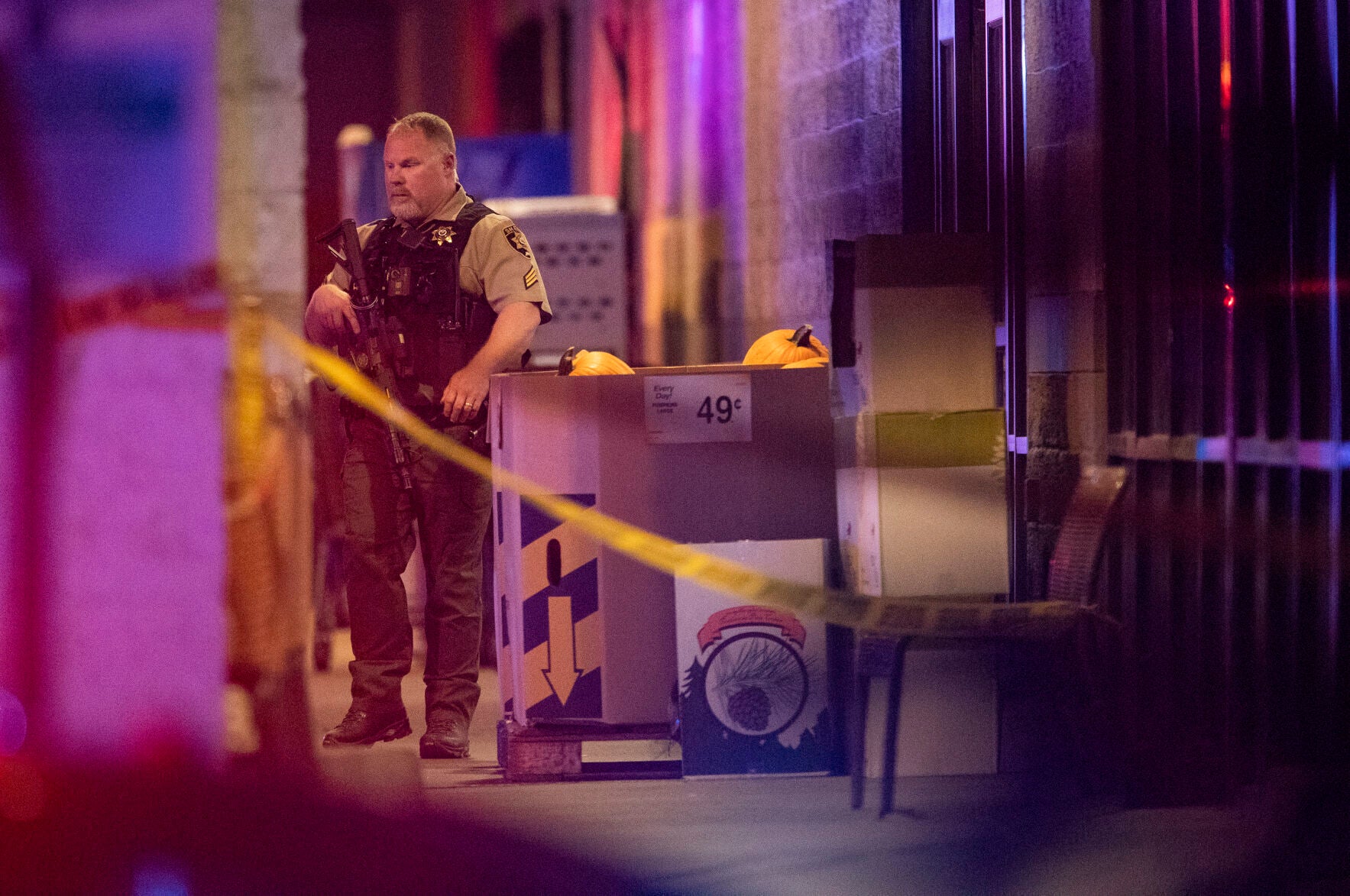 Emergency personnel respond to a shooting that claimed the lives of two victims and the gunman at the Forum shopping center in east Bend, Oregon on Sunday