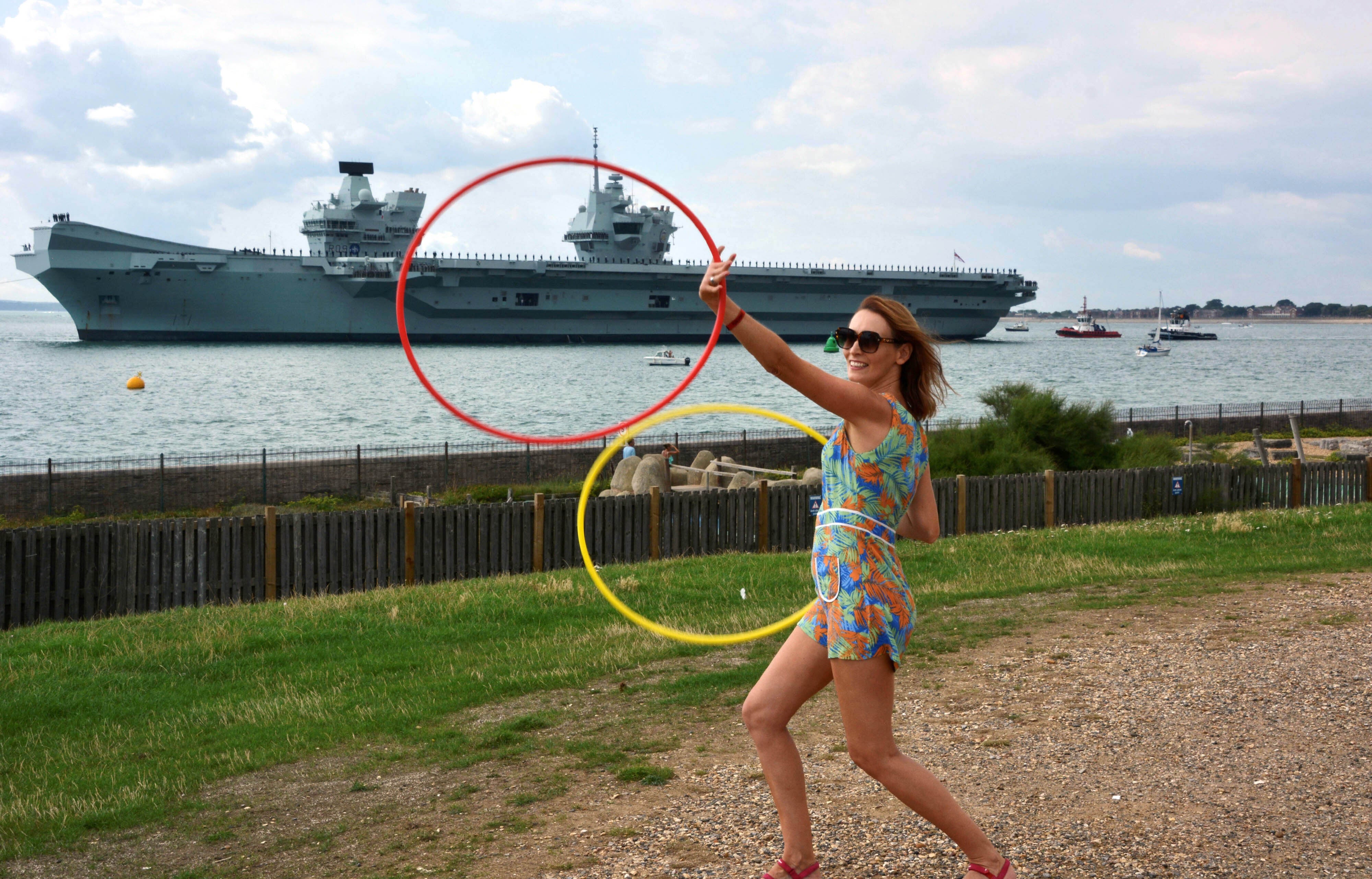 Festival goers at the Victorious Festival on Southsea Common gave Royal Navy aircraft carrier HMS Prince of Wales a colourful send-off (Ben Mitchell/PA)