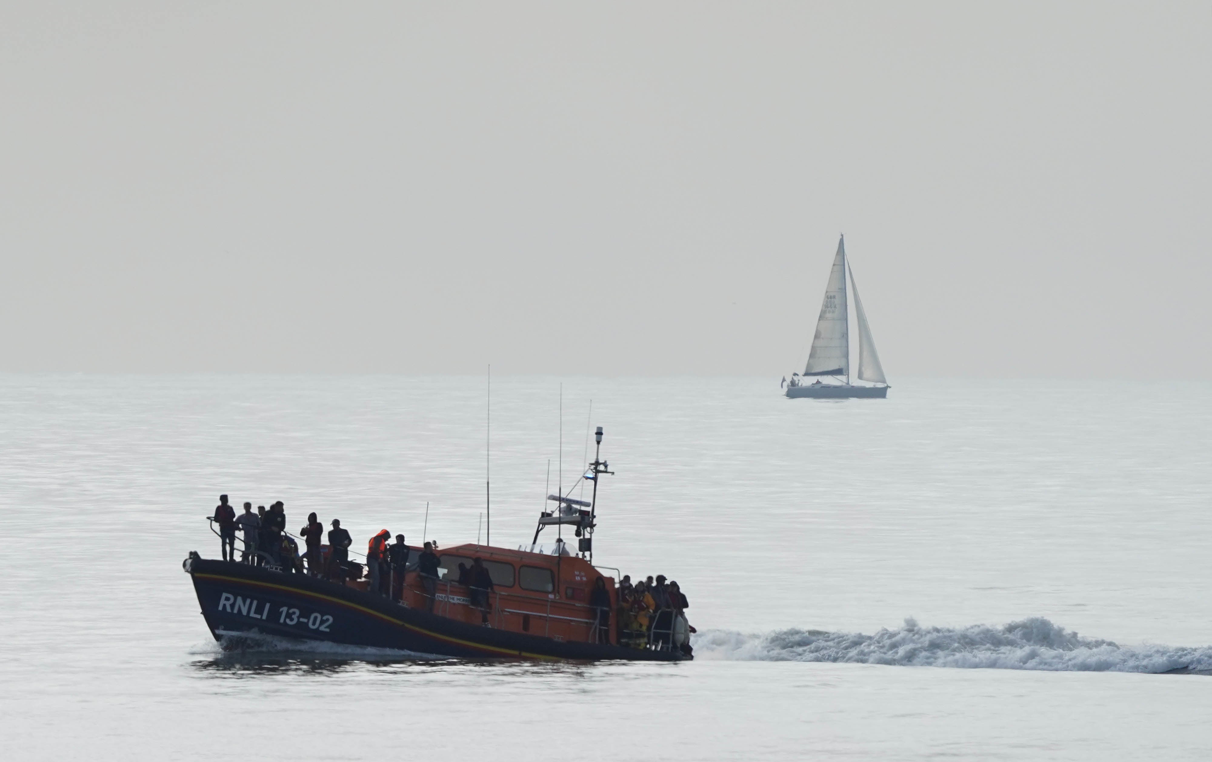 An RNLI lifeboat brings suspected migrants to shore on Saturday after a small boat incident in the Channel