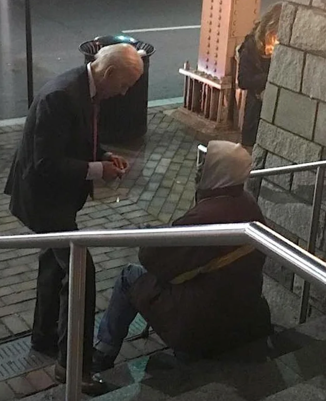 Joe Biden speaking with a man in Washington, DC in 2018