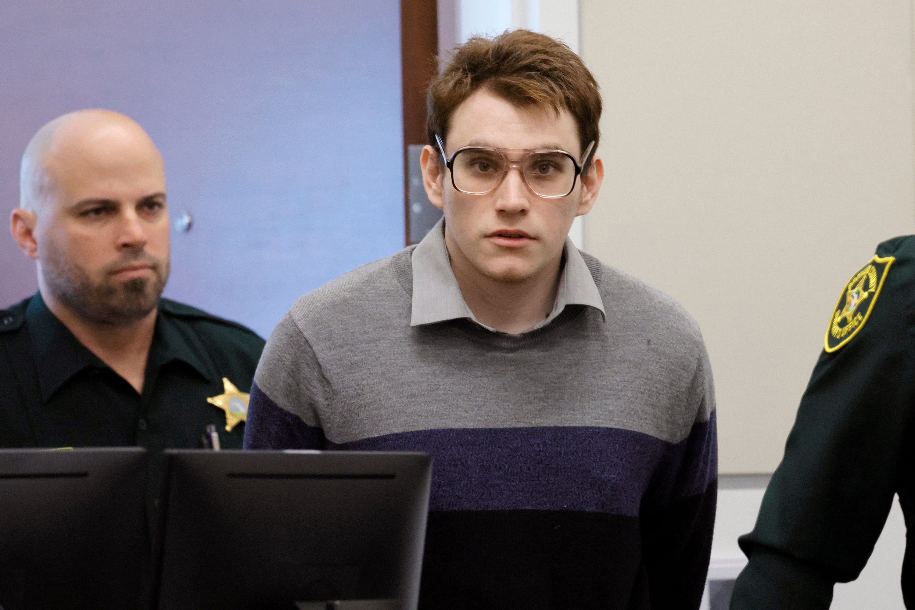 Marjory Stoneman Douglas High School shooter Nikolas Cruz is escorted into the courtroom on 30 August