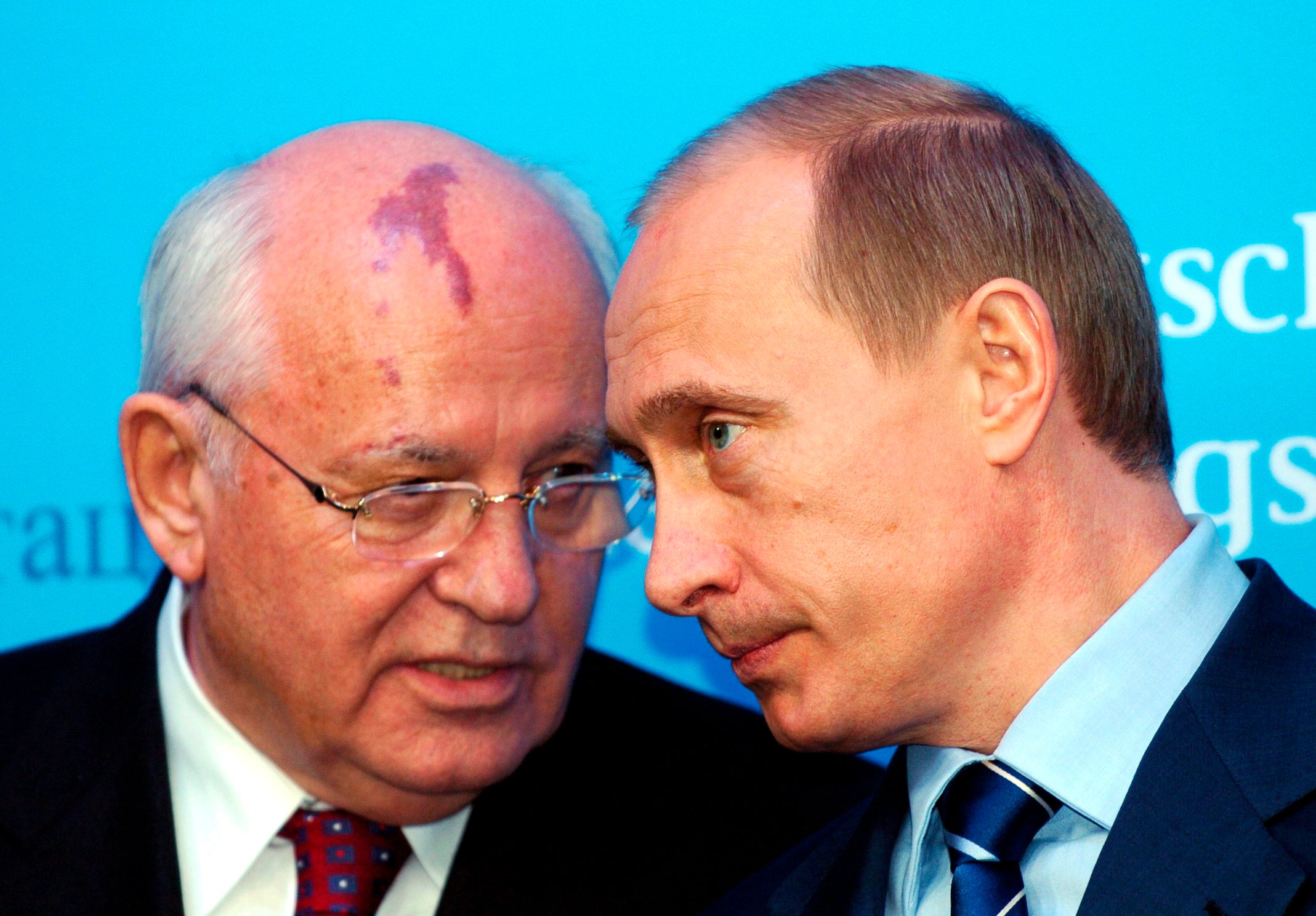 Vladimir Putin talks with former Soviet president Mikhail Gorbachev in 2004