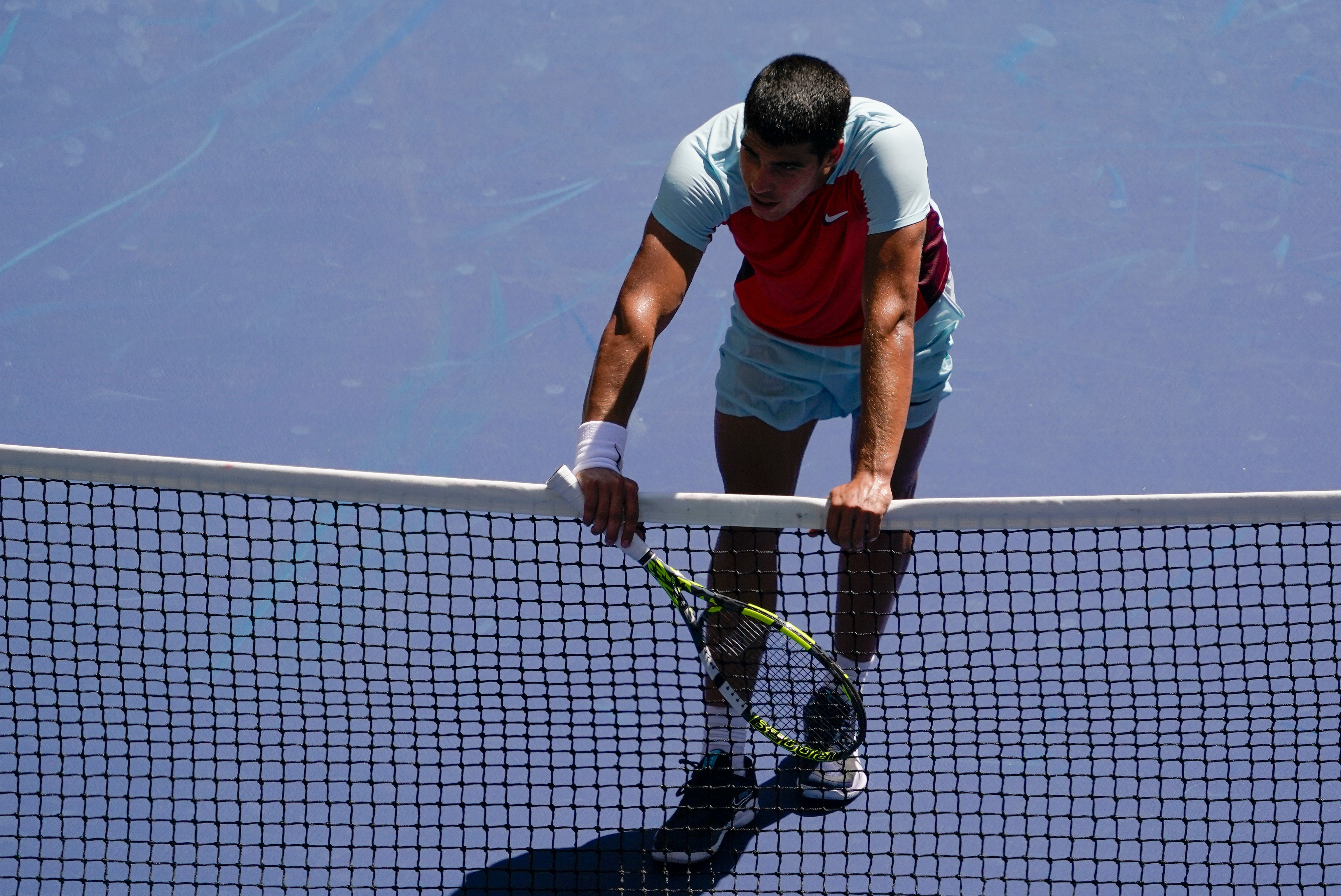 Carlos Alcaraz survived a physical battle with Sebastian Baez (Seth Wenig/AP)