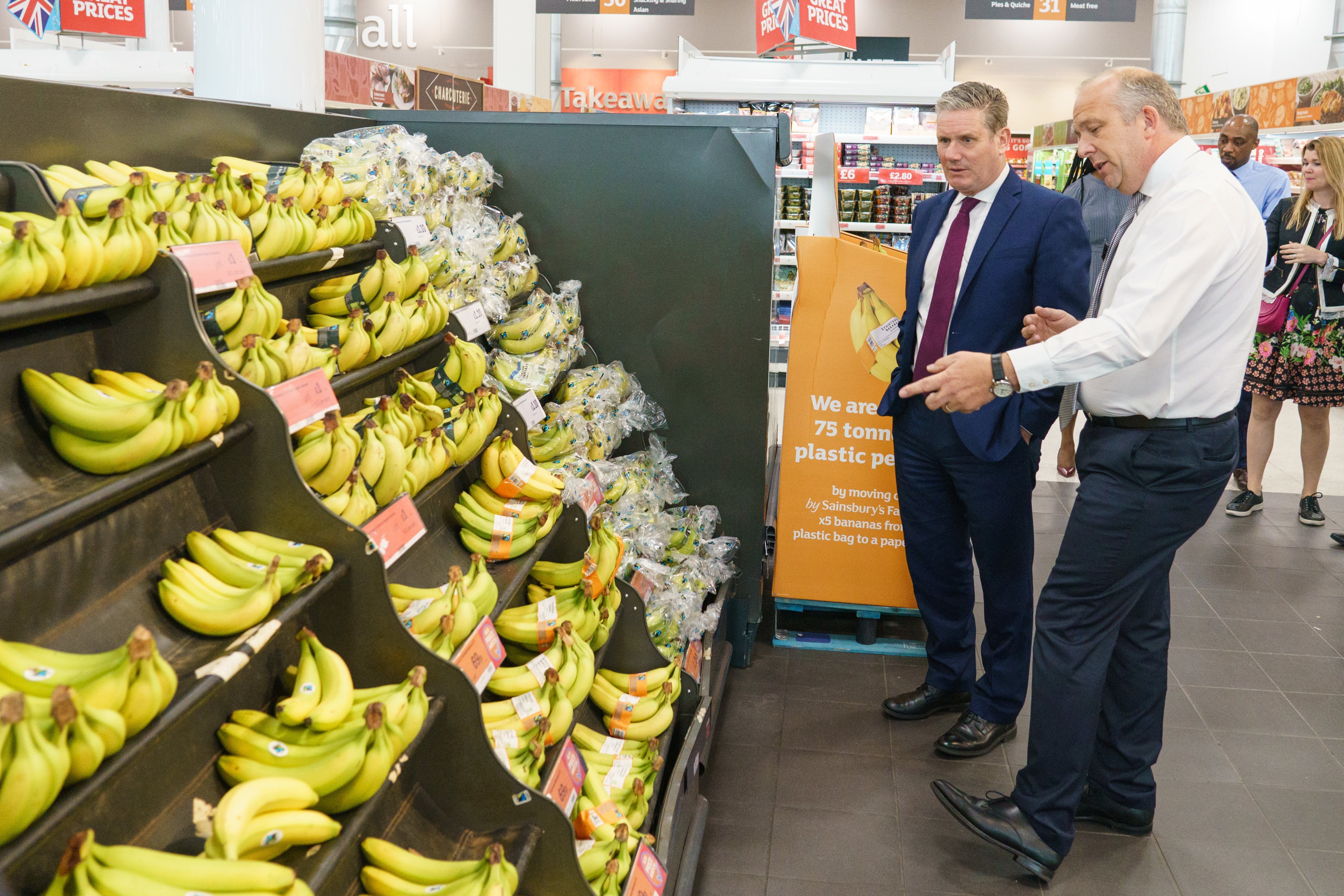 Sainsbury’s chief executive officer Simon Roberts (right) with Labour Party leader Sir Keir Starmer last May (Dominic Lipinski/PA)