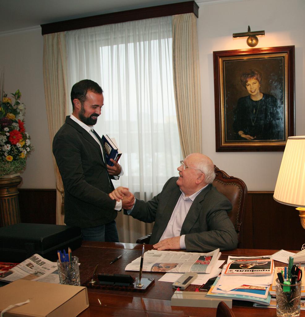 Raisa’s portrait hung in pride of place on the wall, directly behind the leather-covered desk in his study