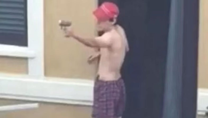 Nikolas Cruz is seen practicing shooting wearing a MAGA hat