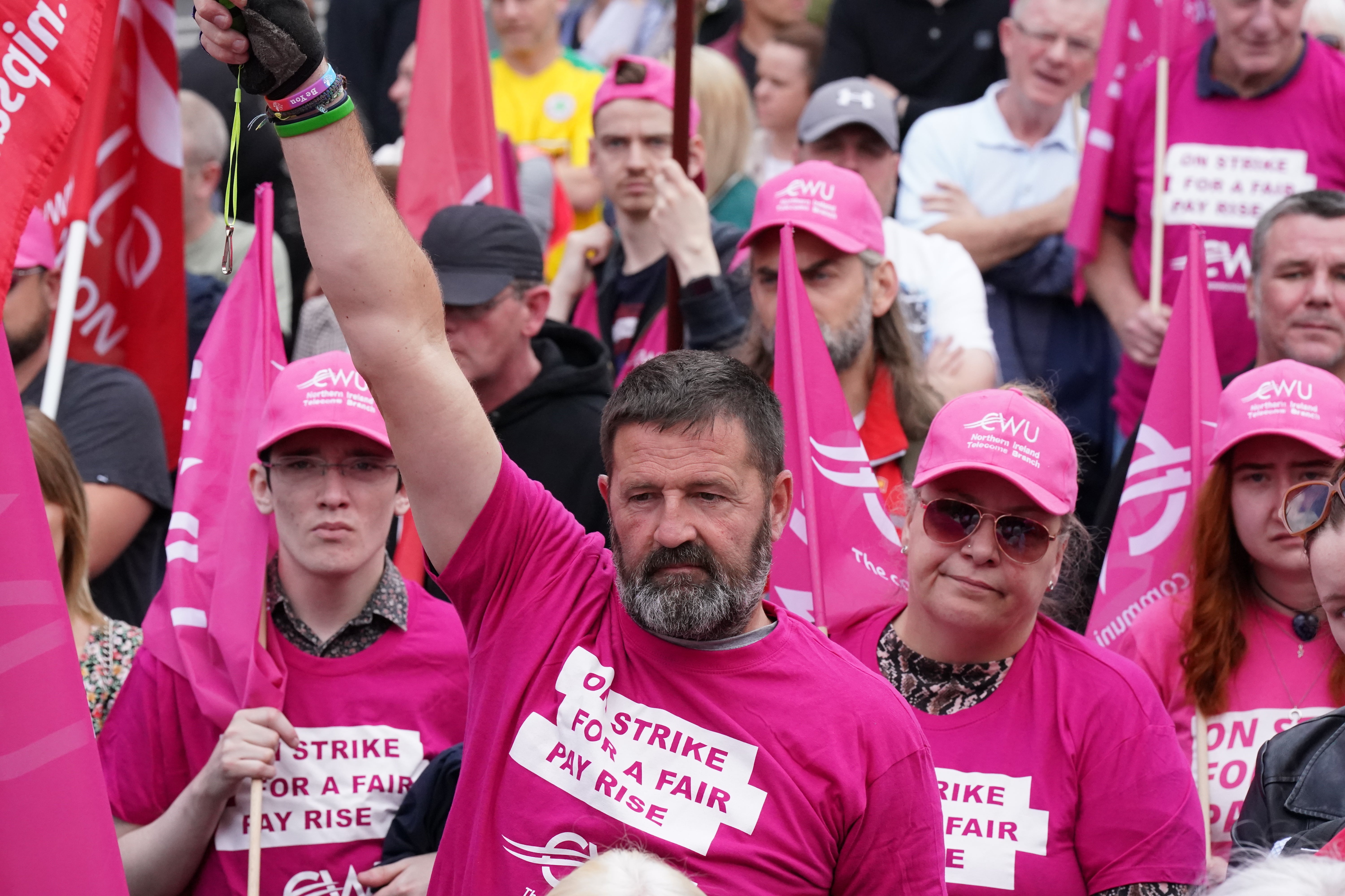 Members of the Communication Workers Union demonstrate during a strike in Belfast city centre (Niall Carson/PA)