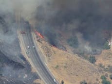 California freeway near Los Angeles shut down by wildfire as heatwave scorches state