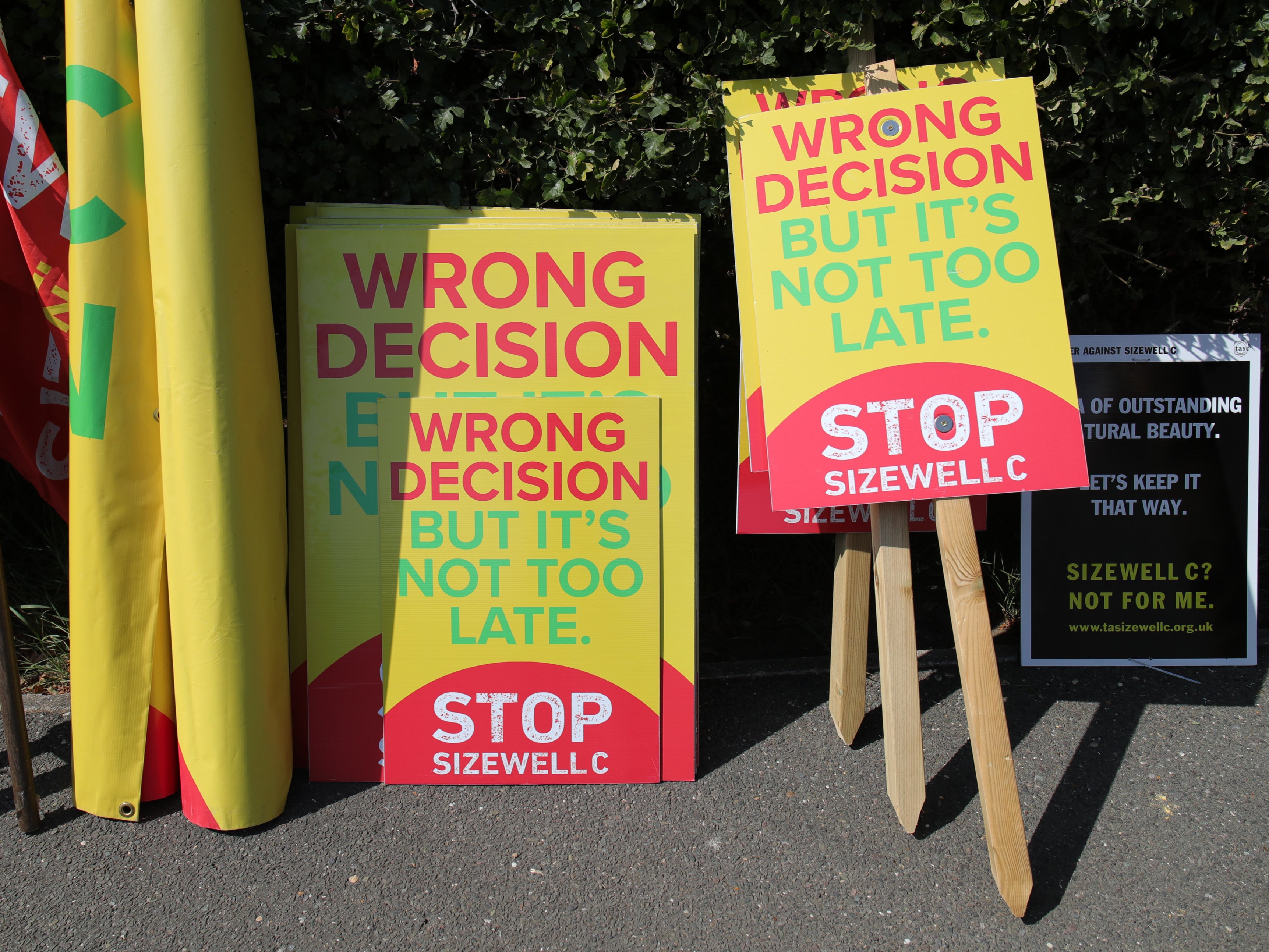 Placards belonging to protesters from the Stop Sizewell C and Together Against Sizewell C