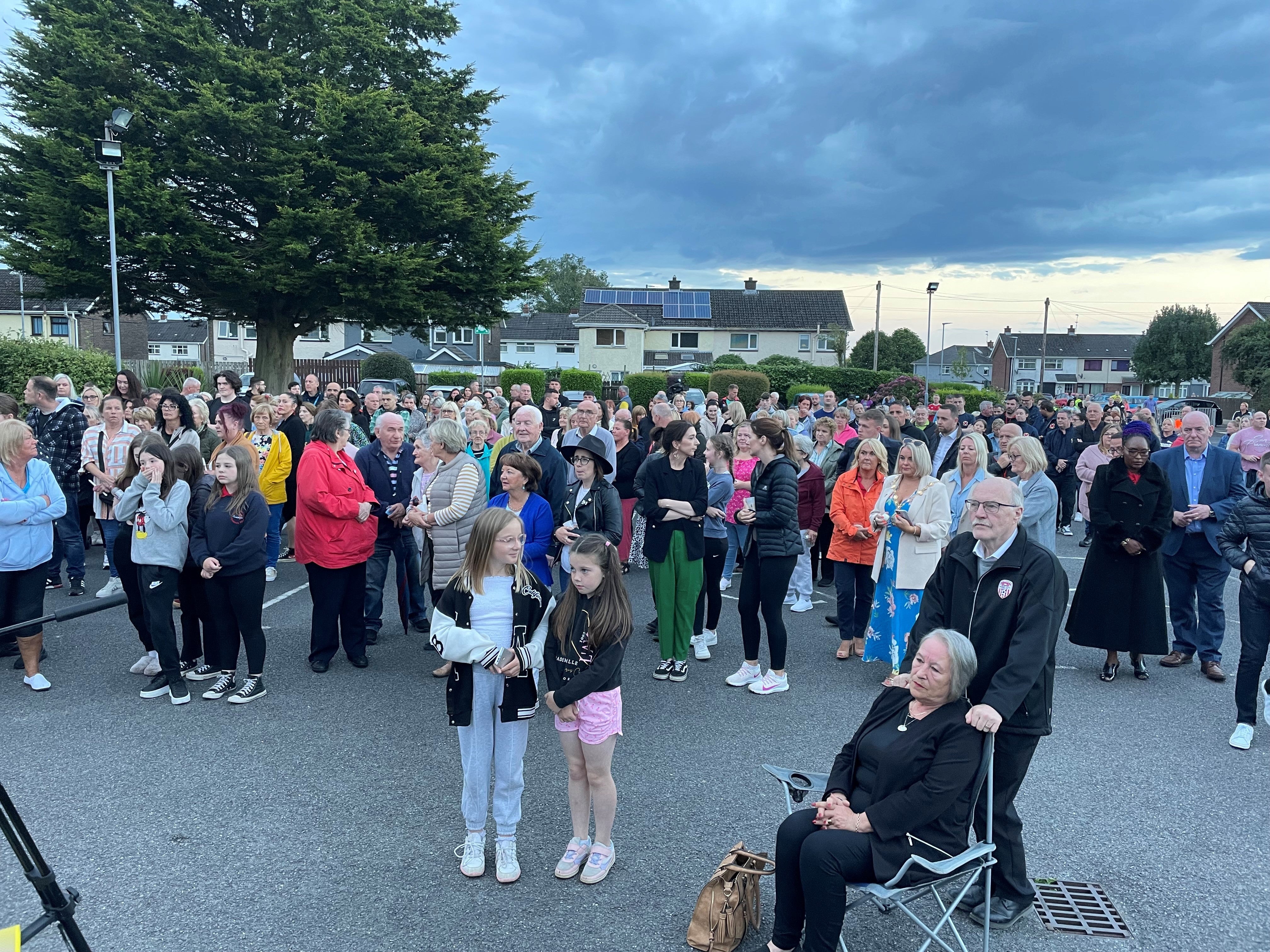 People at St Oliver Plunkett church in Strathfoyle at a vigil for Reuven Simon and Joseph Sebastian (Jonathan McCambridge/PA)