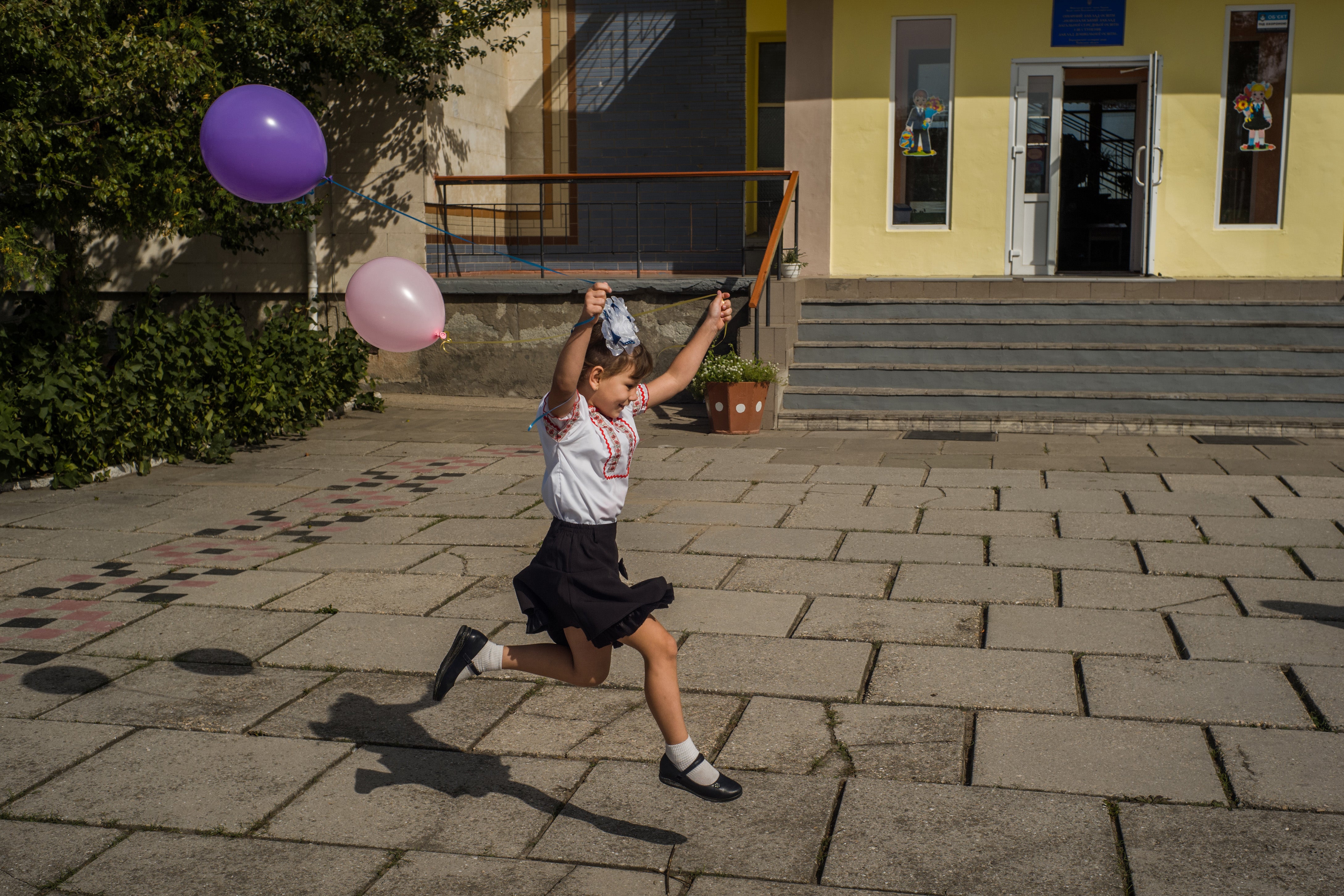 Children were joyous upon returning to school after the summer, even in wartime