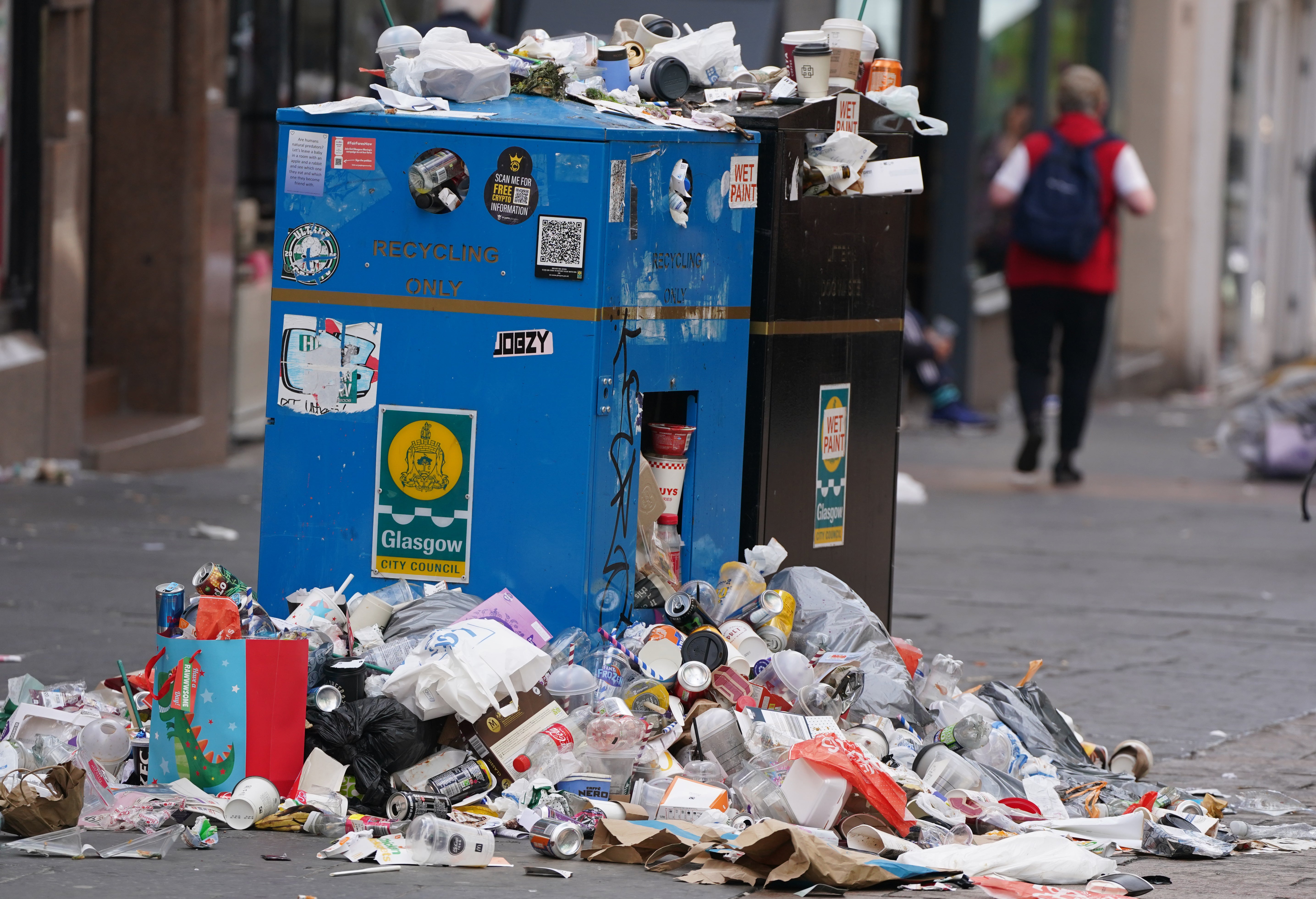 Mountains of rubbish have piled up in city centres (Andrew Milligan/PA)