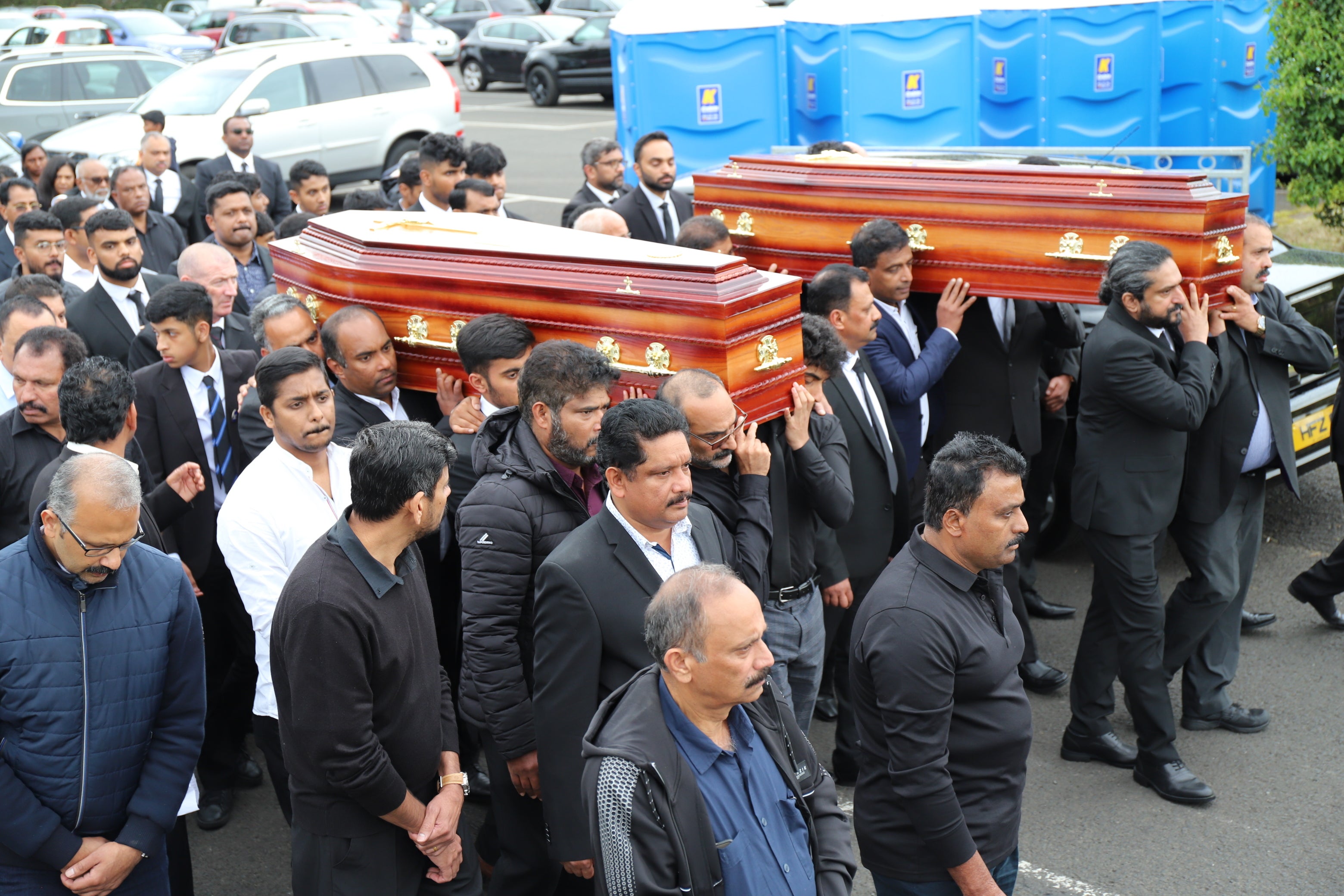 The coffins of Reuven Simon and Joseph Sebastian are brought from St Mary’s Church in Ardmore (Joe Boland/PA)