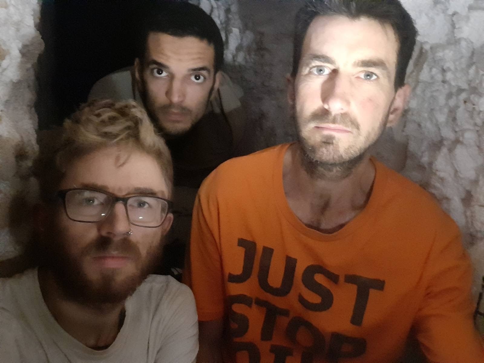 From left: Joe Howlett, 32, Xavier Gonzalez-Trimmer, 21, and Samuel Johnson, 39, occupy a tunnel dug beneath St Clements Way in Grays, Essex (Samuel Johnson/PA)