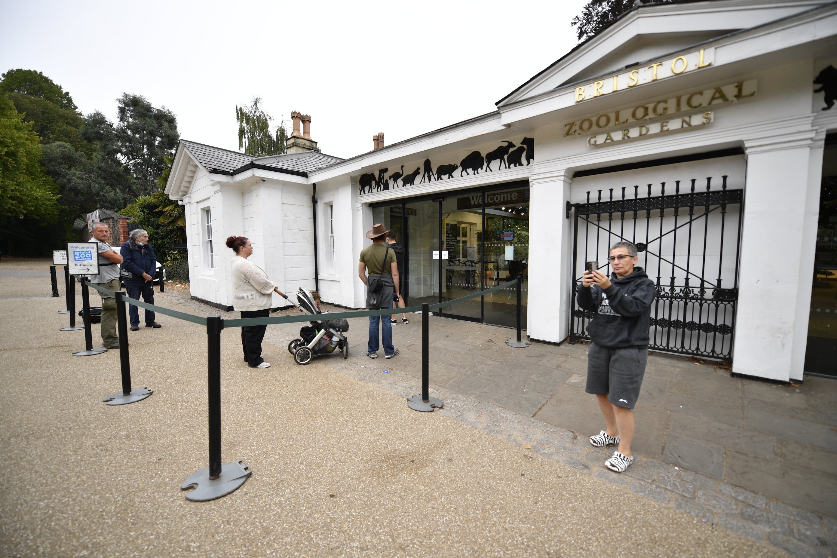 Visitors wait at the entrance to Bristol Zoo Gardens on its last day open to the public (Beresford Hodge/PA)