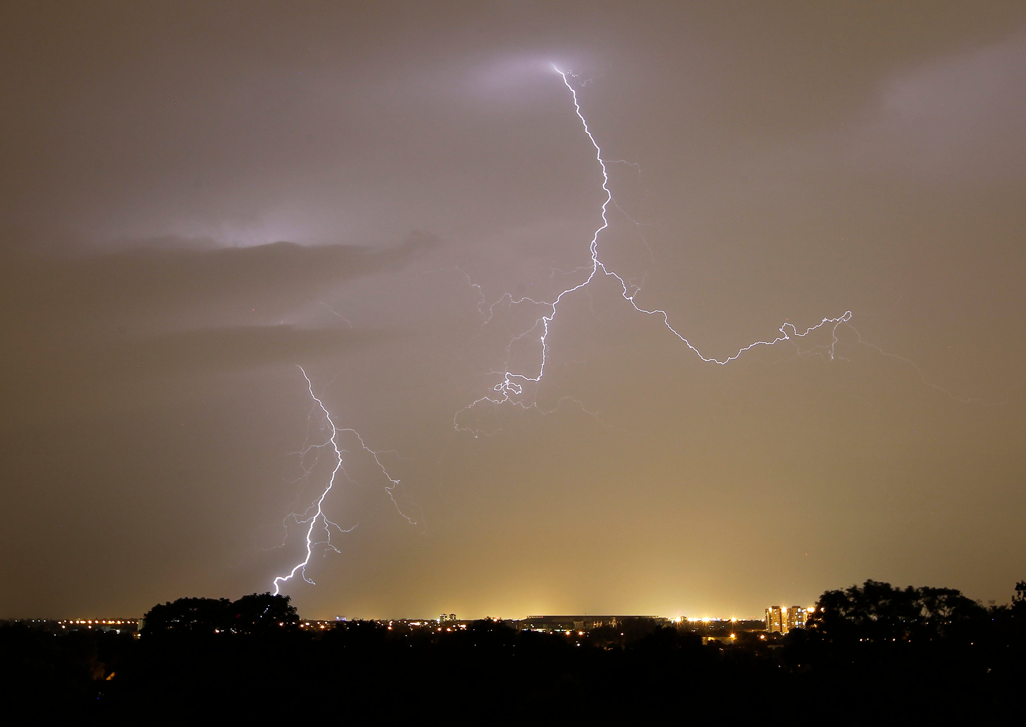 An orange weather warning has been put in place for 13 counties amid the threat of lightning strikes (PA)