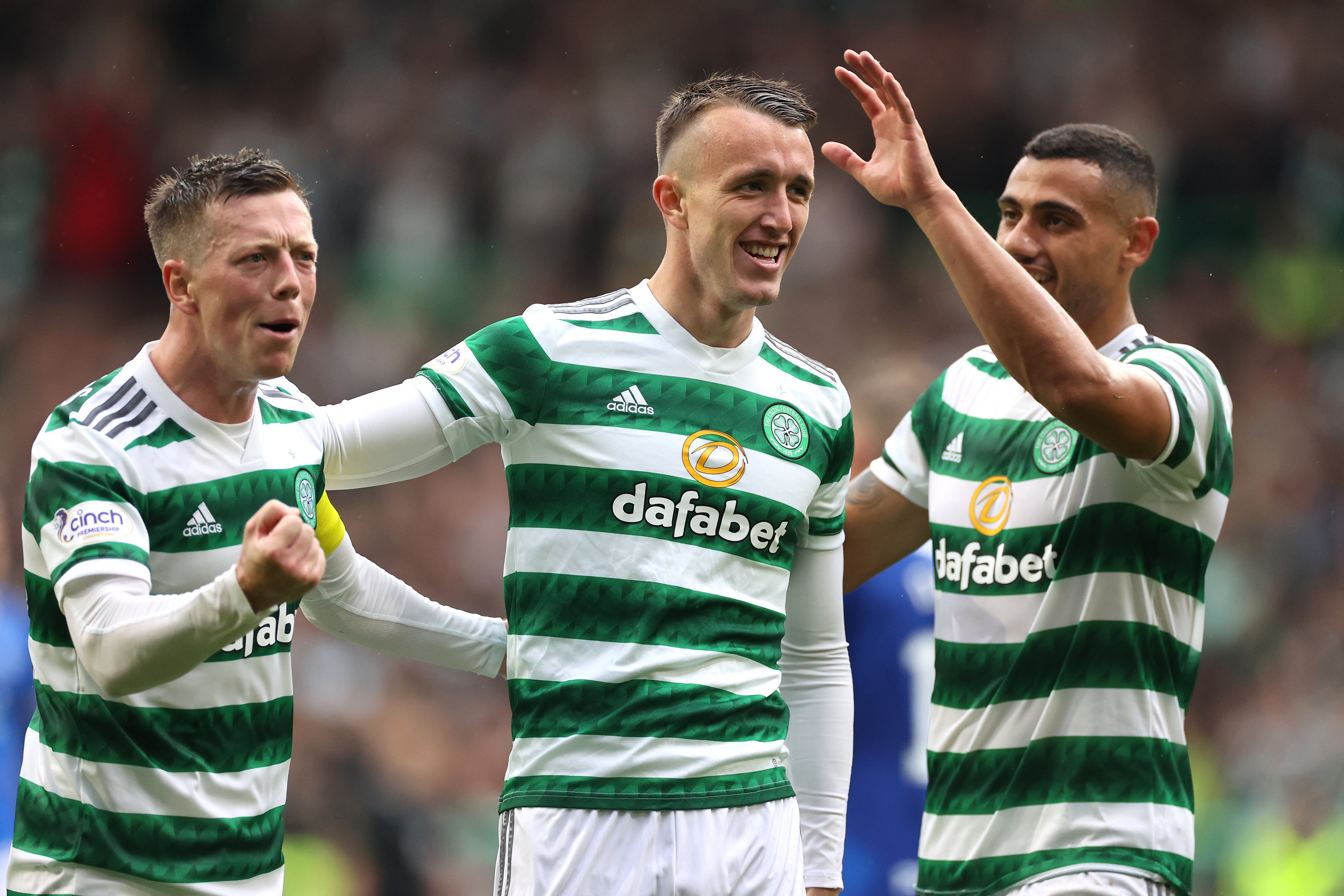 Celtic’s David Turnbull (centre) celebrates the fourth goal in the win over Rangers (Steve Welsh/PA)