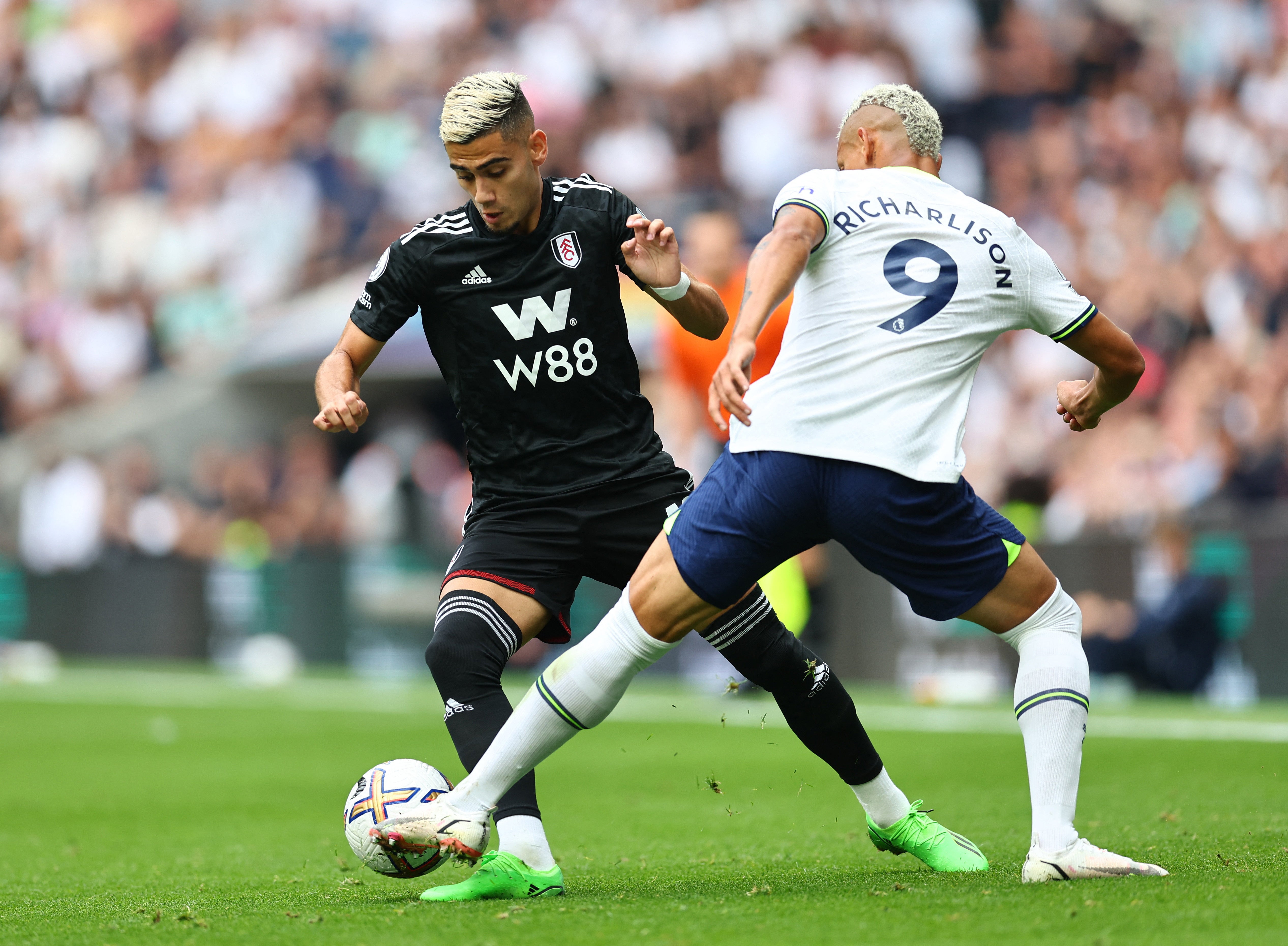 Fulham midfielder Andreas takes on Richarlison