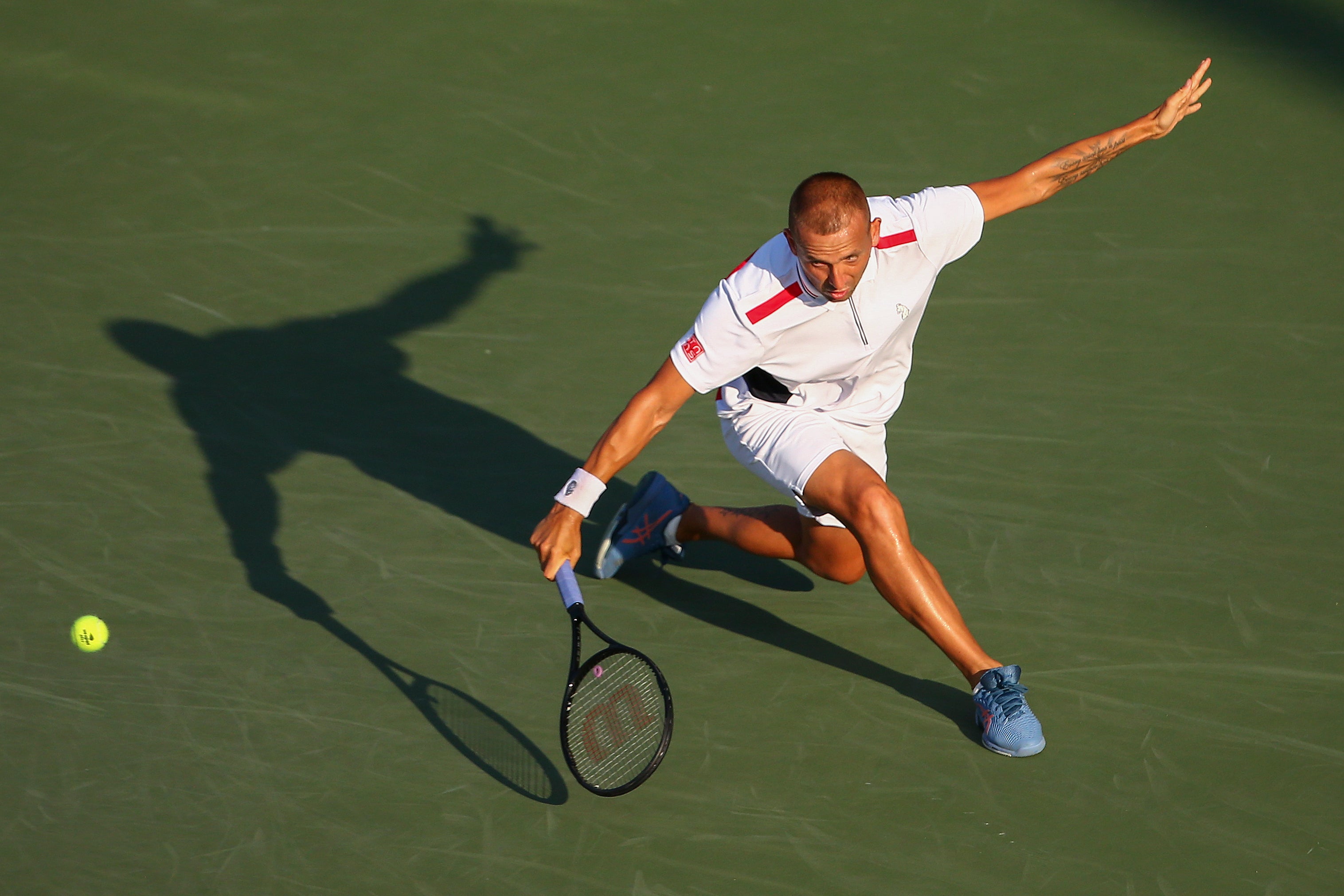 Dan Evans hits a backhand during his loss to Marin Cilic (Andres Kudacki/AP)