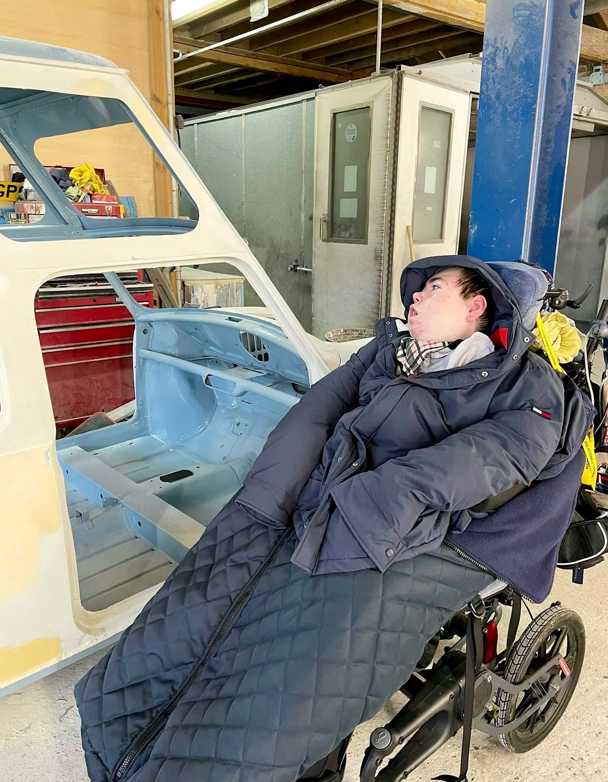 Charlie with the van as it was being converted by his father