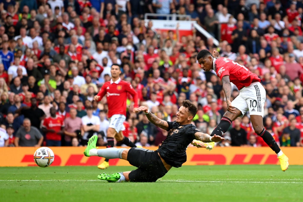 Marcus Rashford fires past the despairing challenge of Ben White to restore Manchester United’s lead