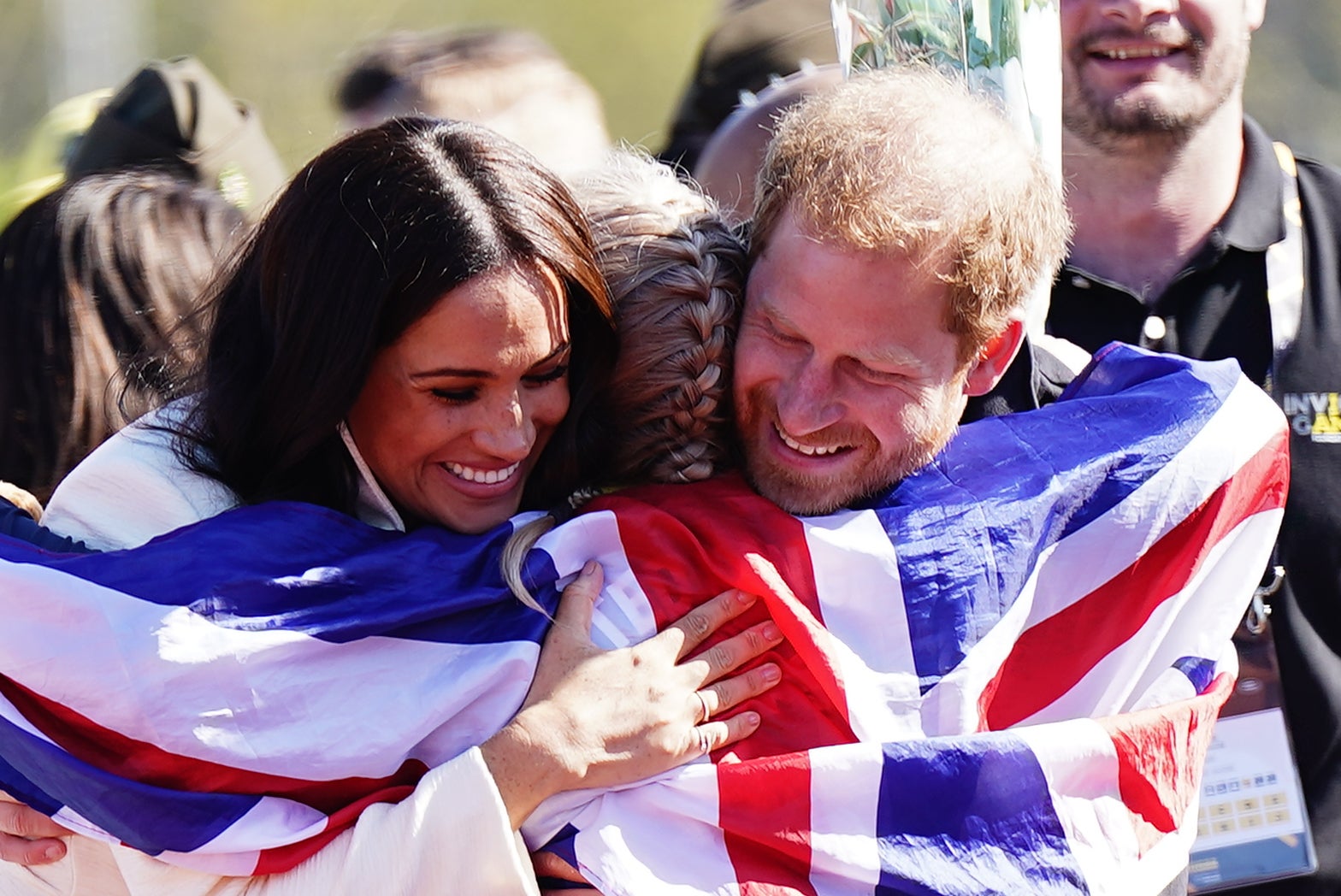 The Duke and Duchess of Sussex hug Team United Kingdom competitor Lisa Johnston at the Invictus Games athletics events in the Athletics Park, at Zuiderpark the Hague, Netherlands. Picture date: Sunday April 17, 2022 (Aaron Chown/PA)