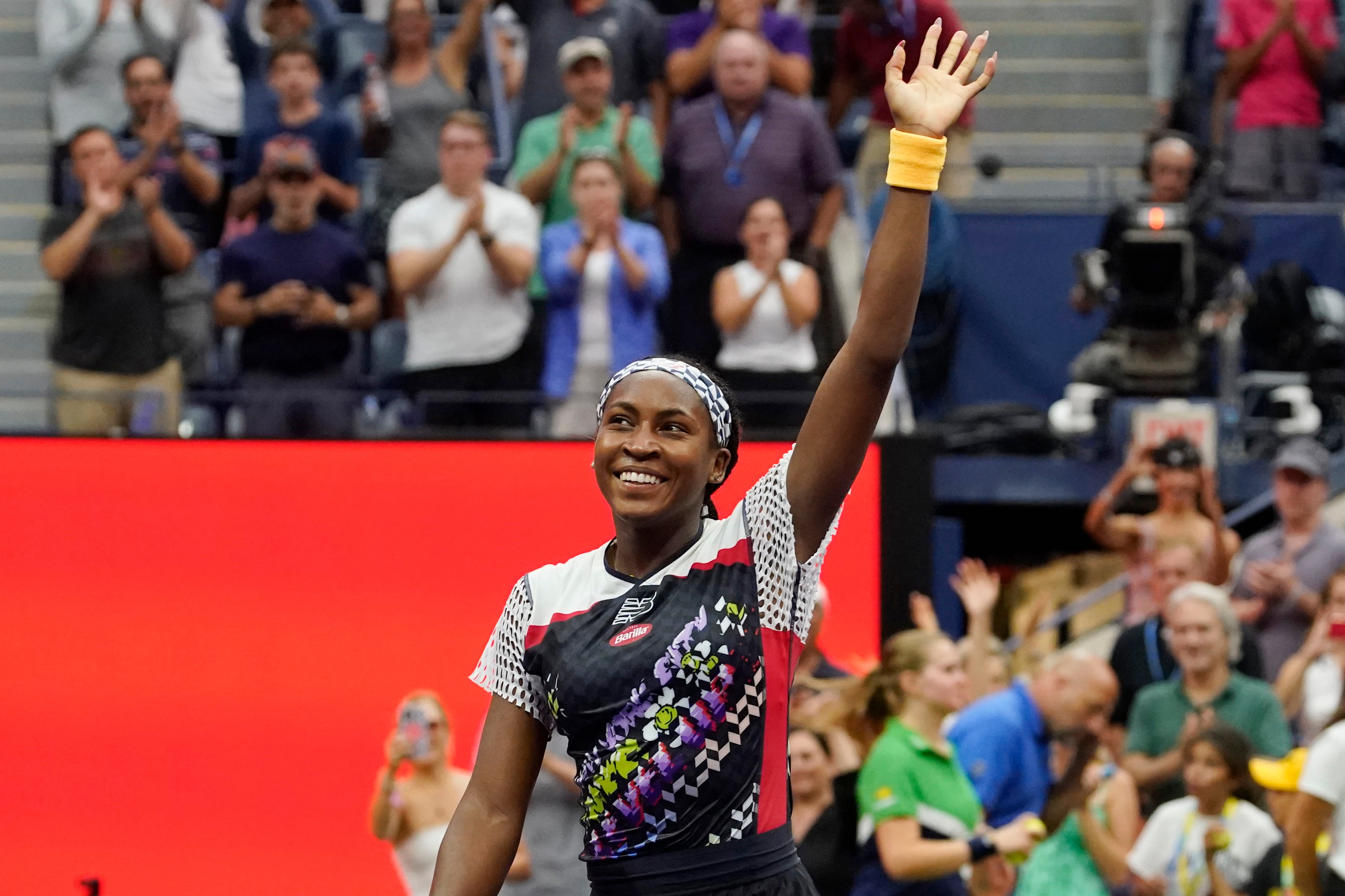 Coco Gauff soaks in the adulation after her victory over Zhang Shuai (Eduardo Munoz Alvarez/AP)